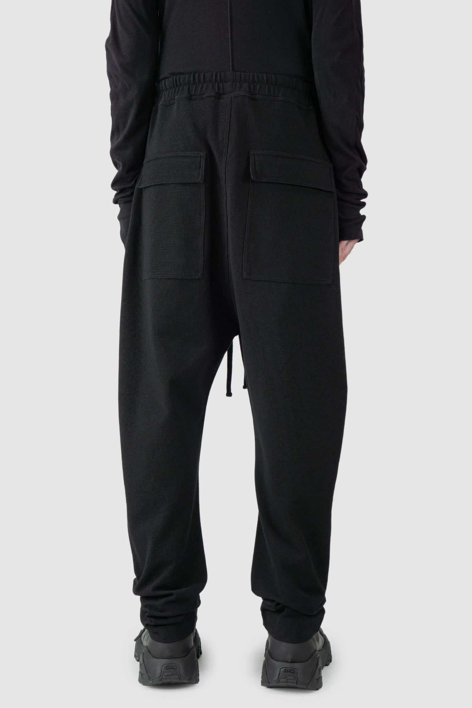 Thom Krom - model back view of black Loose Fit Straight Leg Cotton Trousers - M-ST-503