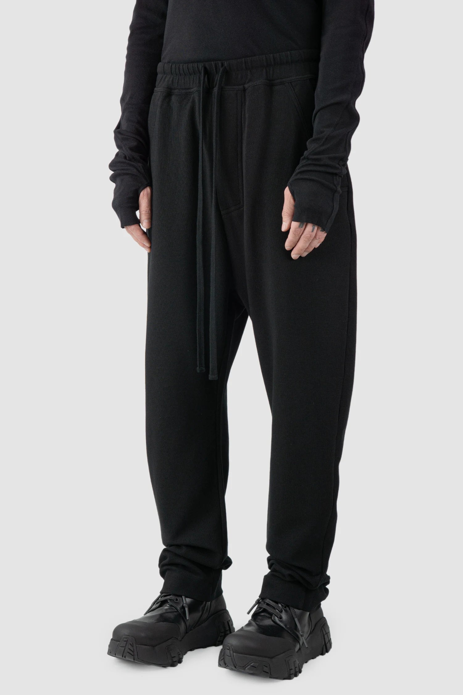 Thom Krom - model front side view of black Loose Fit Straight Leg Cotton Trousers - M-ST-503