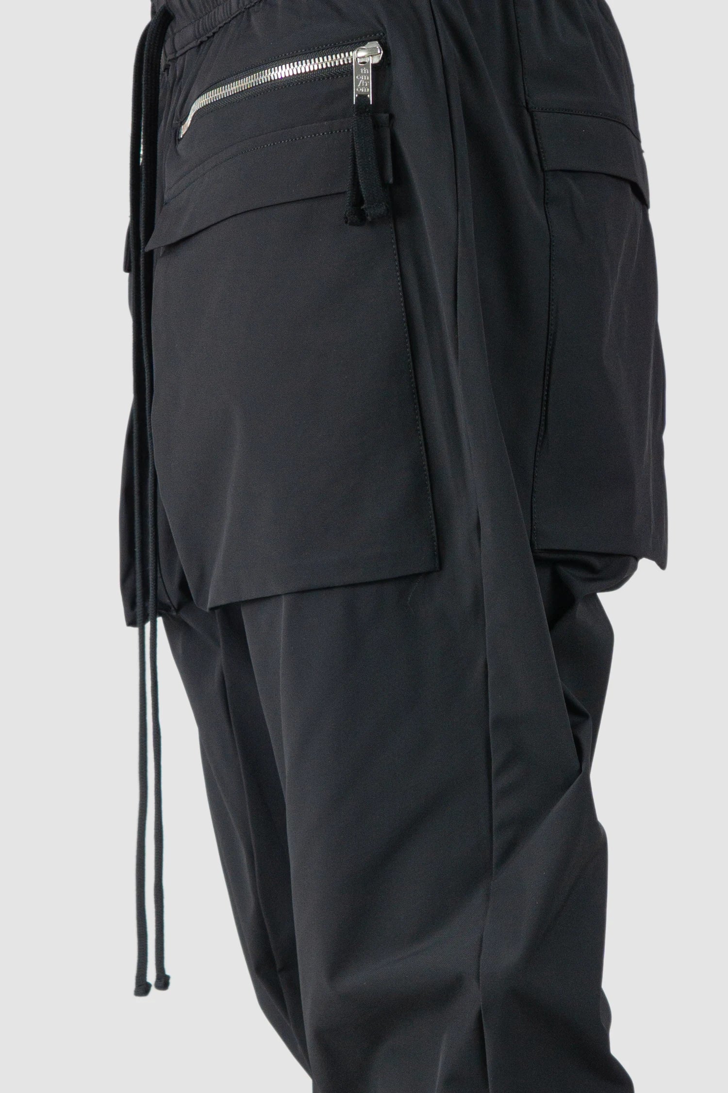 Thom Krom - model pocket detail view of men’s FW25 Black Front Pocket Woven Stretch Cargo Trousers - M-P-27