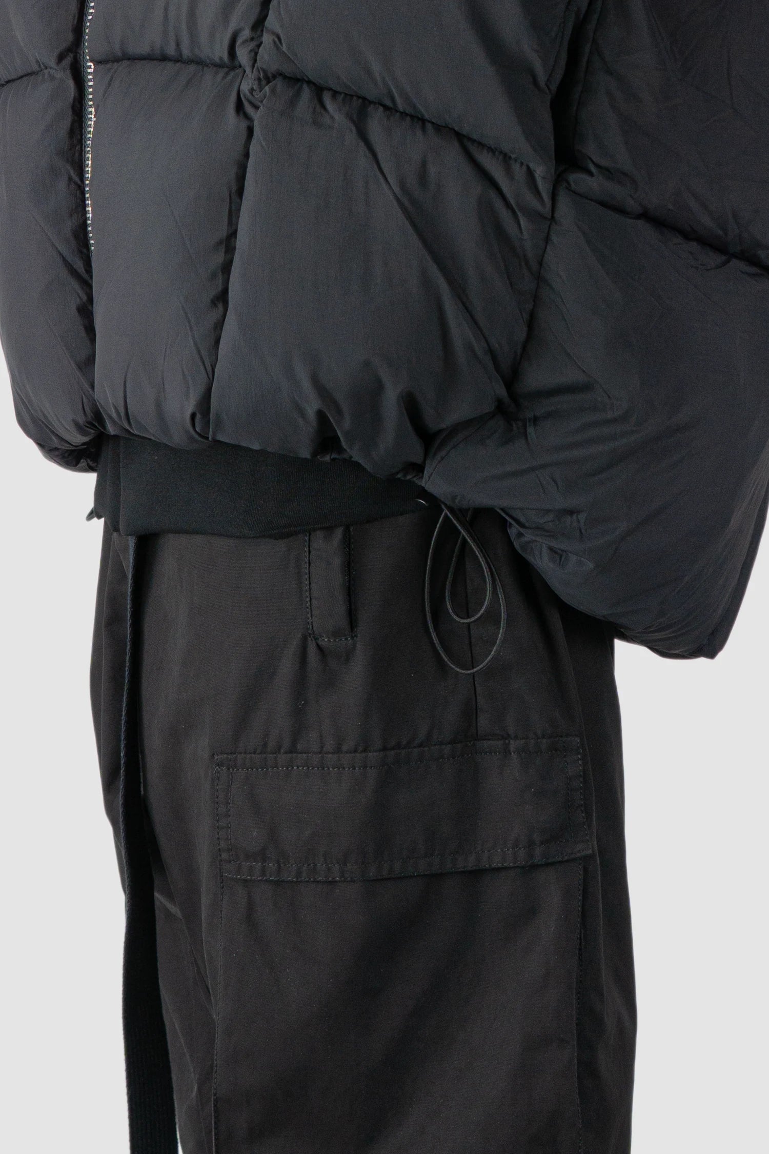 Thom Krom - model hem detail view of men’s Black Guilted Nylon Puffer Jacket M-J-78