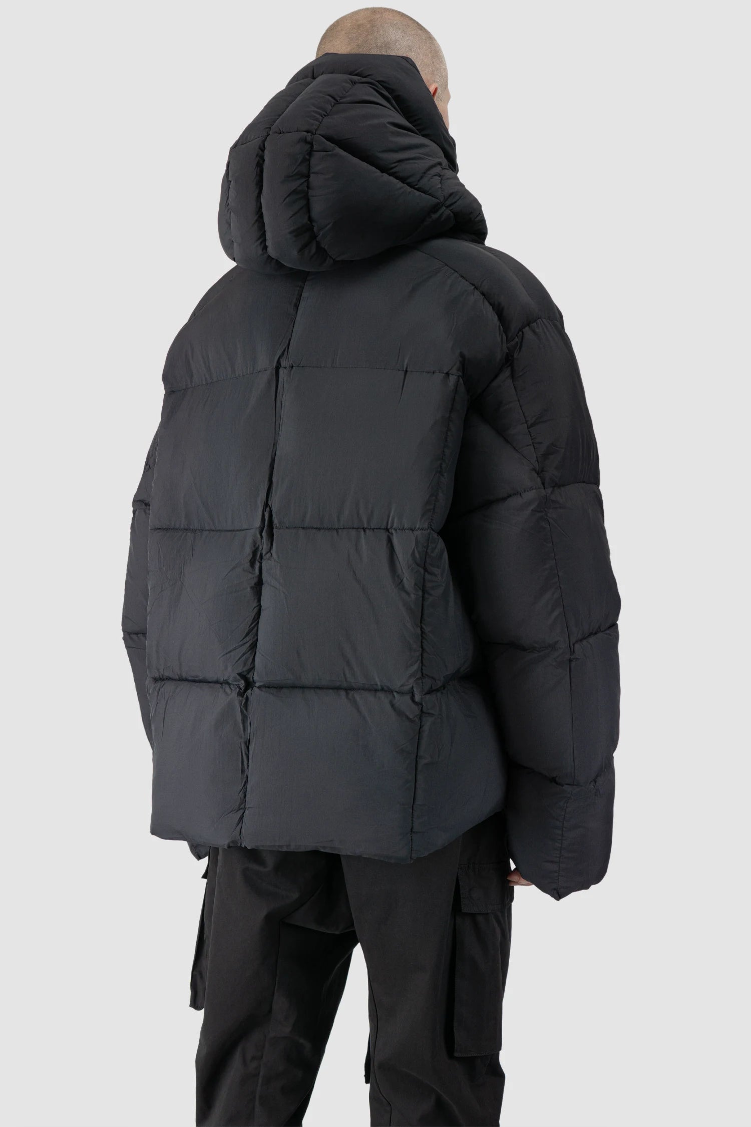 Thom Krom - model back side view of men’s Black Guilted Nylon Puffer Jacket M-J-78