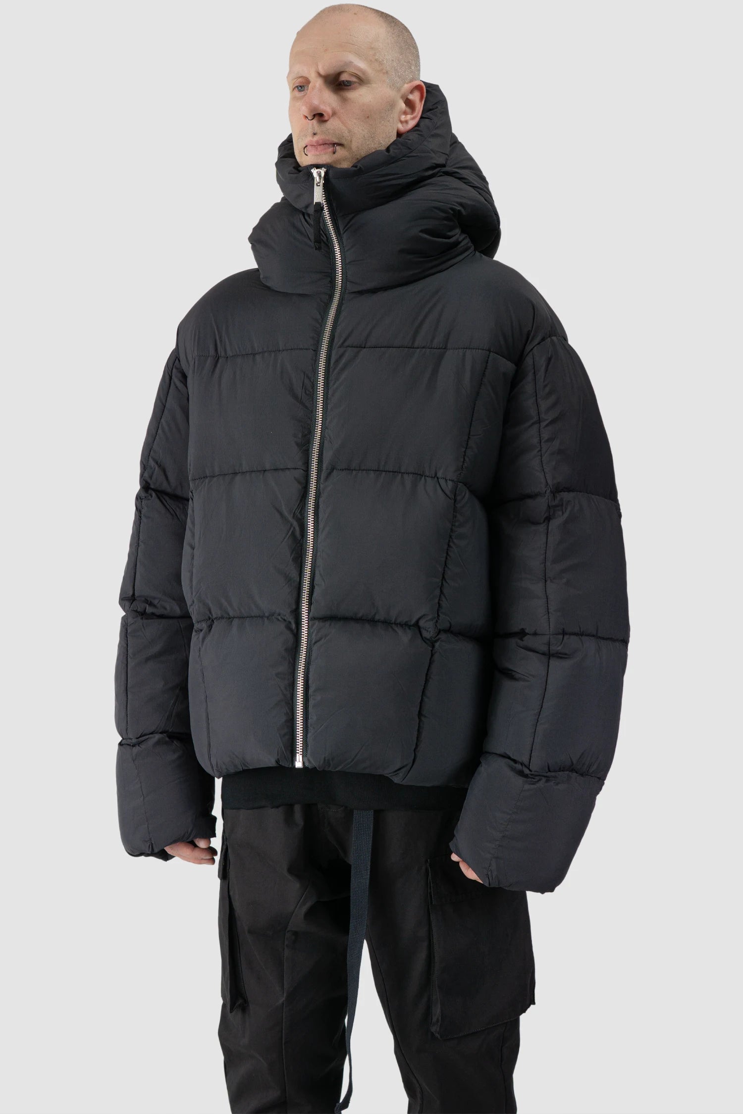 Thom Krom - model front side view of men’s Black Guilted Nylon Puffer Jacket M-J-78