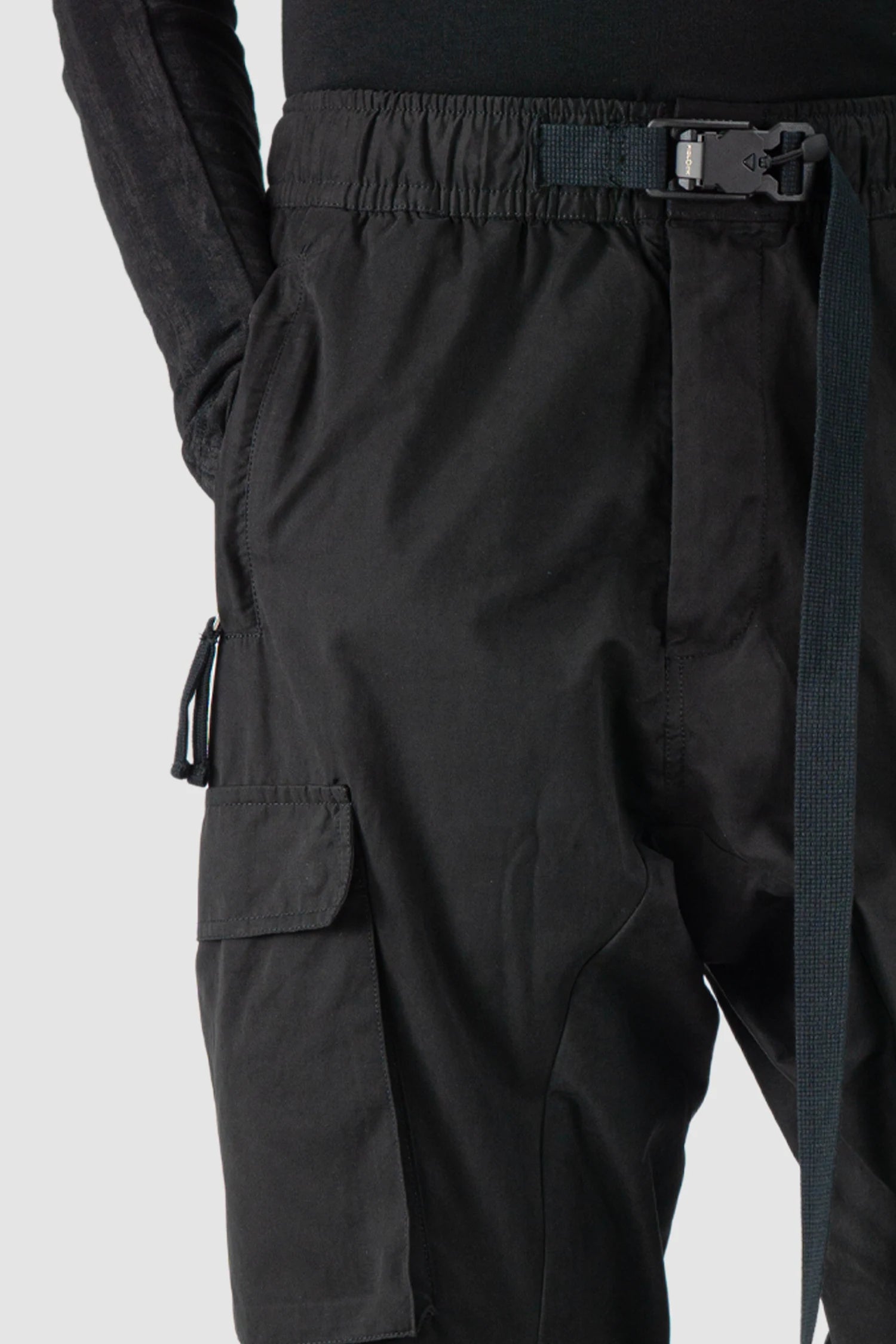 Thom Krom - model belt detail view of men’s FW25 Black Peached Cotton Cargo Trousers with Magnetic Belt - M-P-15