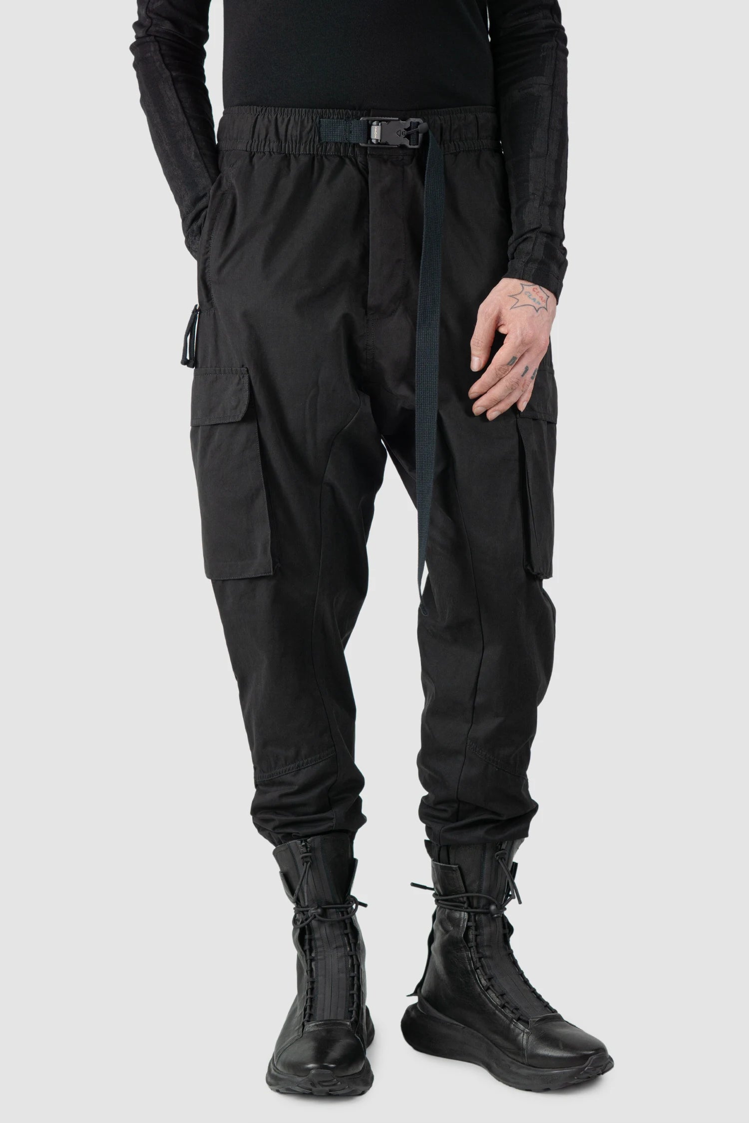 Thom Krom - model front relaxed view of men’s FW25 Black Peached Cotton Cargo Trousers with Magnetic Belt - M-P-15