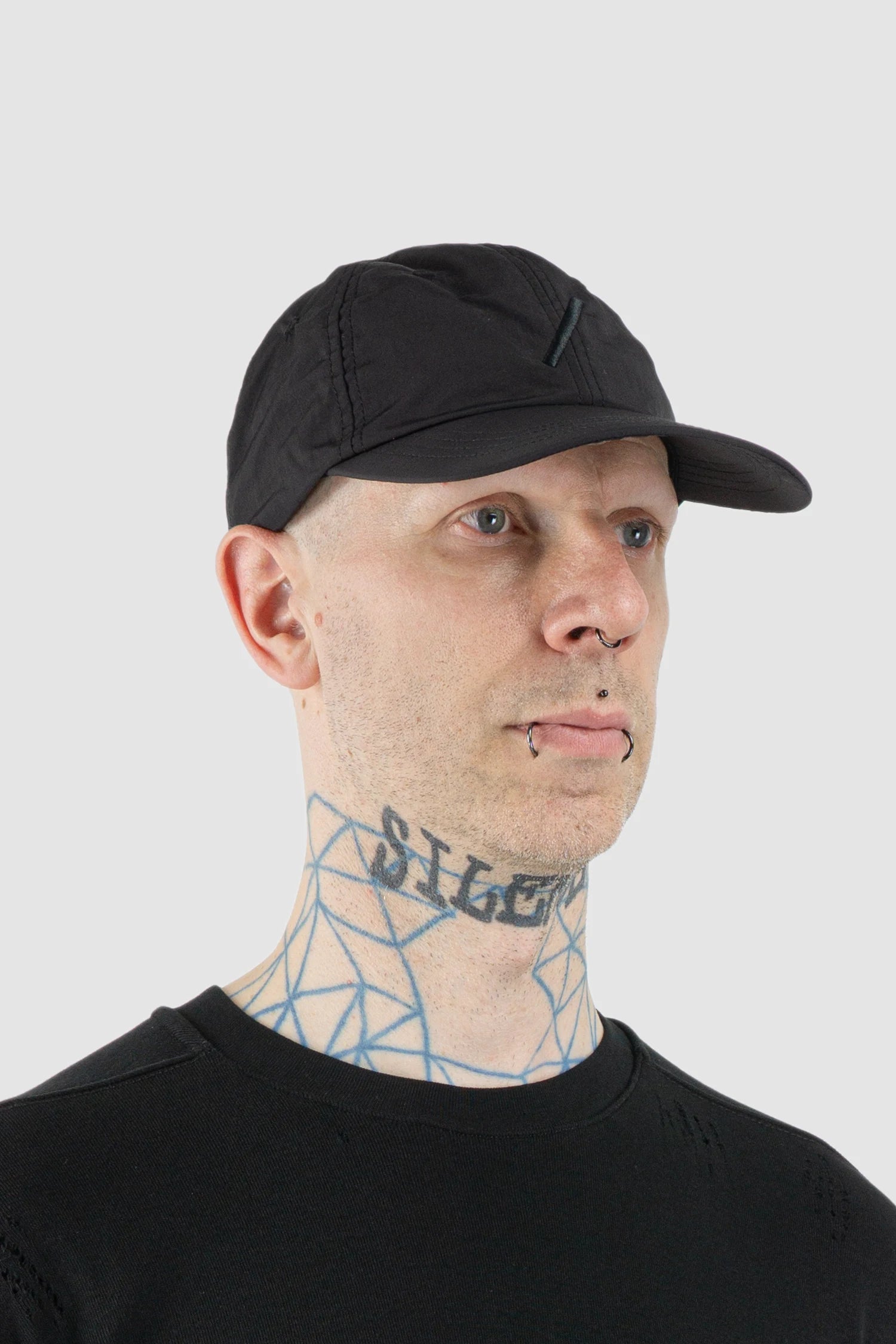 Thom Krom – Men's Black Slash Logo Base Cap - model side view - MONO-KROM | Gallery Thom Krom – Men's Black Slash Logo Base Cap - model side view - MONO-KROM | Gallery