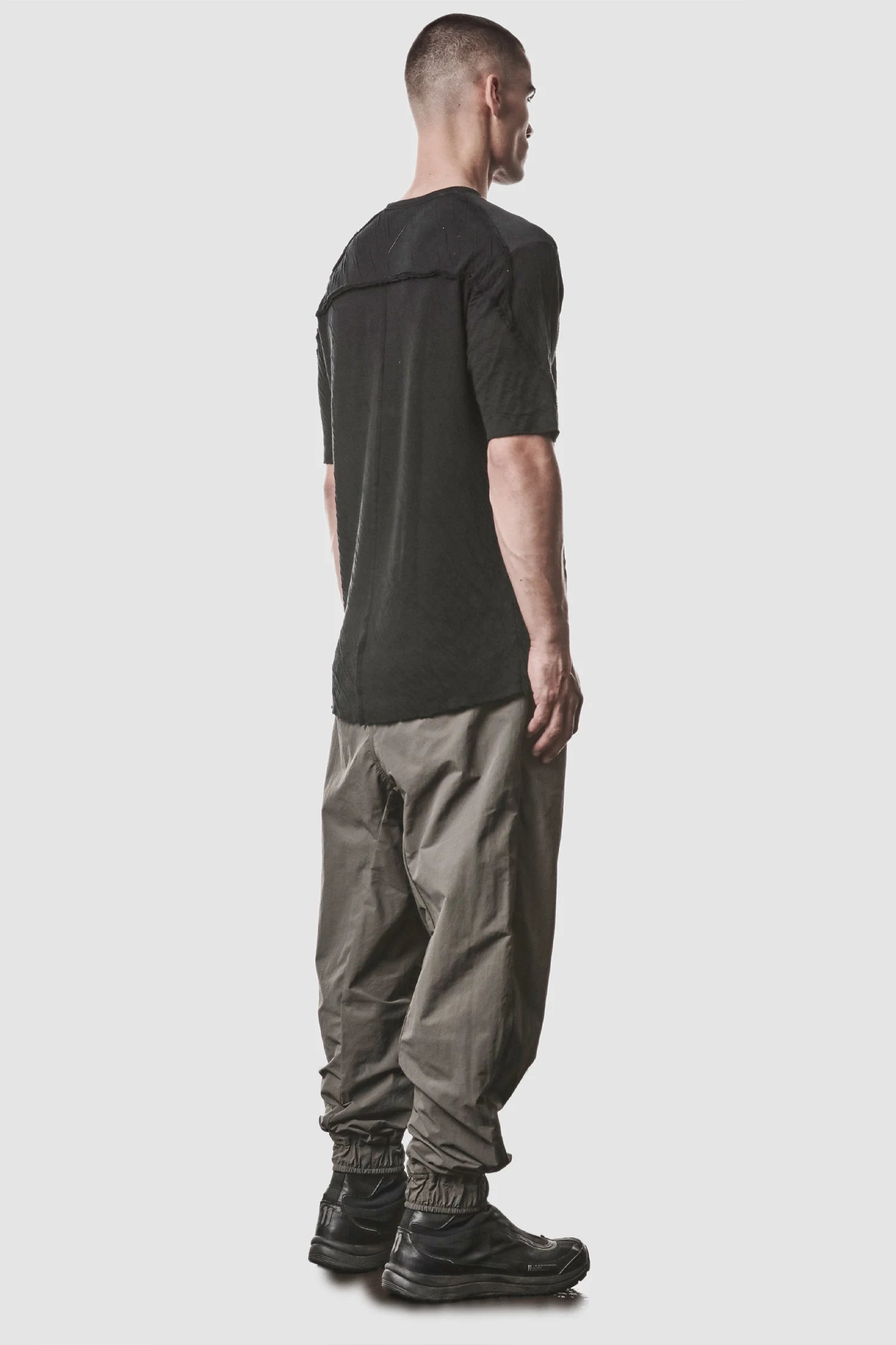 Thom Krom - model back full view of men’s Black Bonded Double Layer Cotton T-Shirt