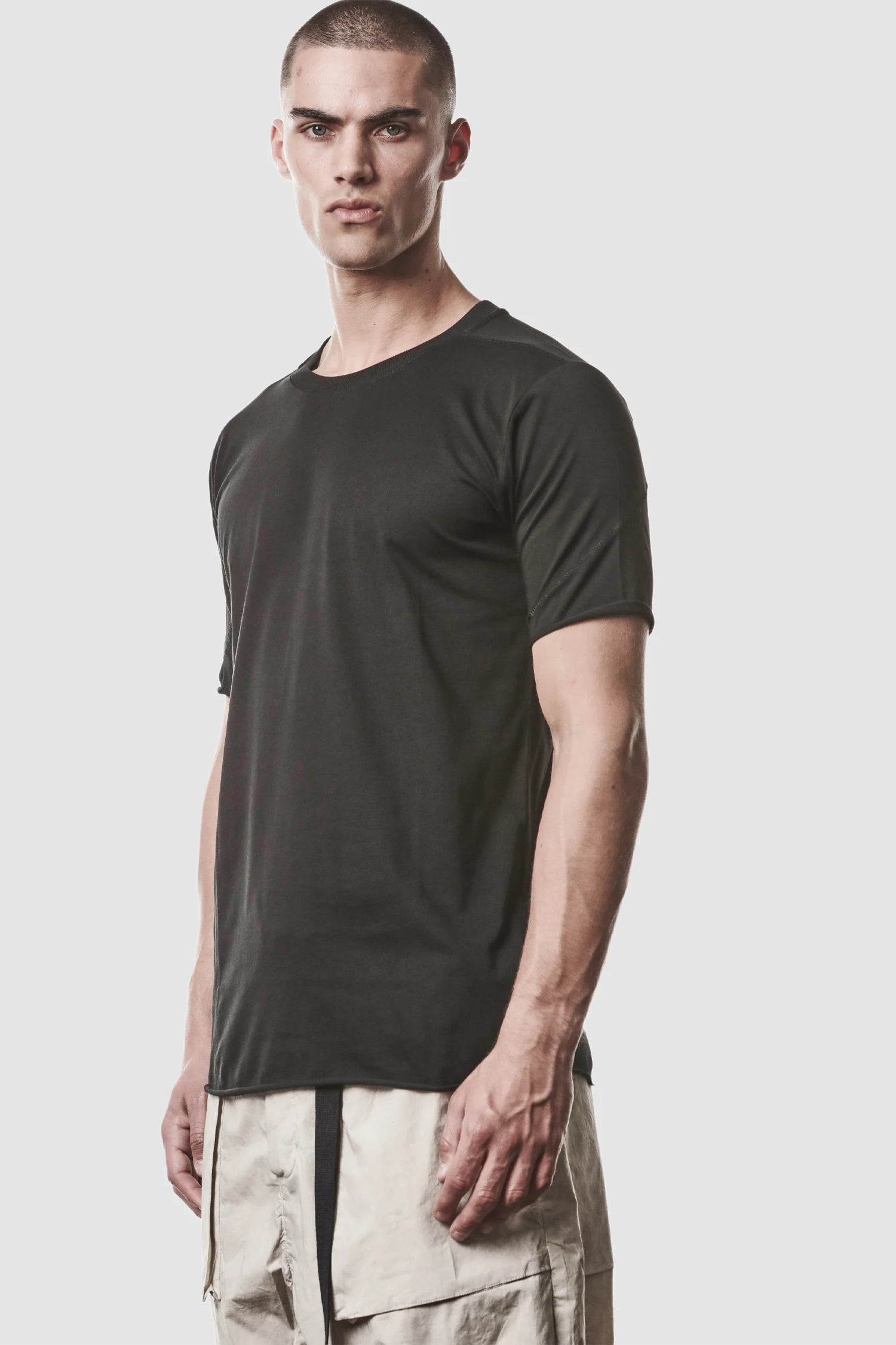 Thom Krom - model front side view of men’s Black Round Neck Cotton T-Shirt