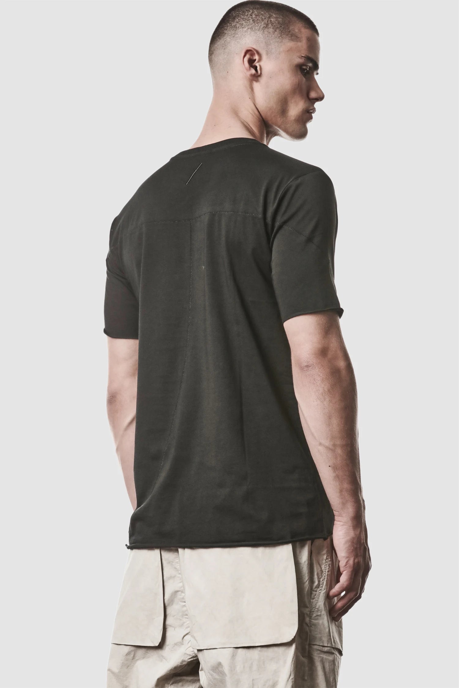 Thom Krom - model back side view of men’s Black Round Neck Cotton T-Shirt