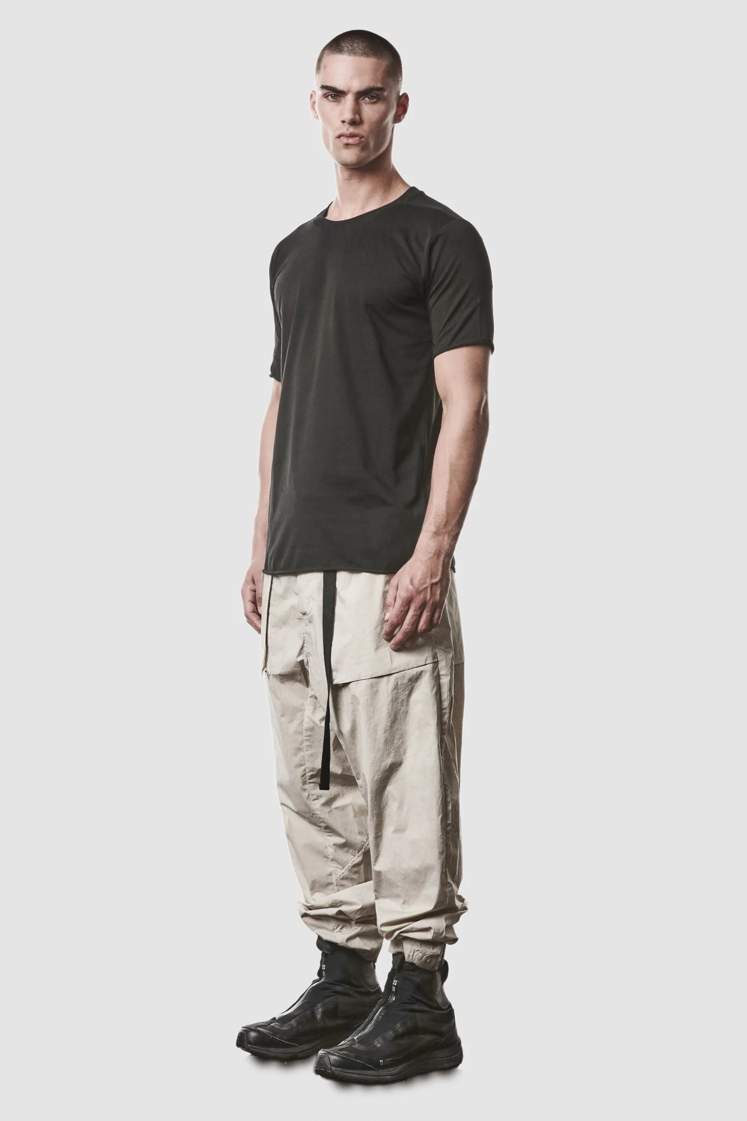 Thom Krom - model front side full view of men’s Black Round Neck Cotton T-Shirt