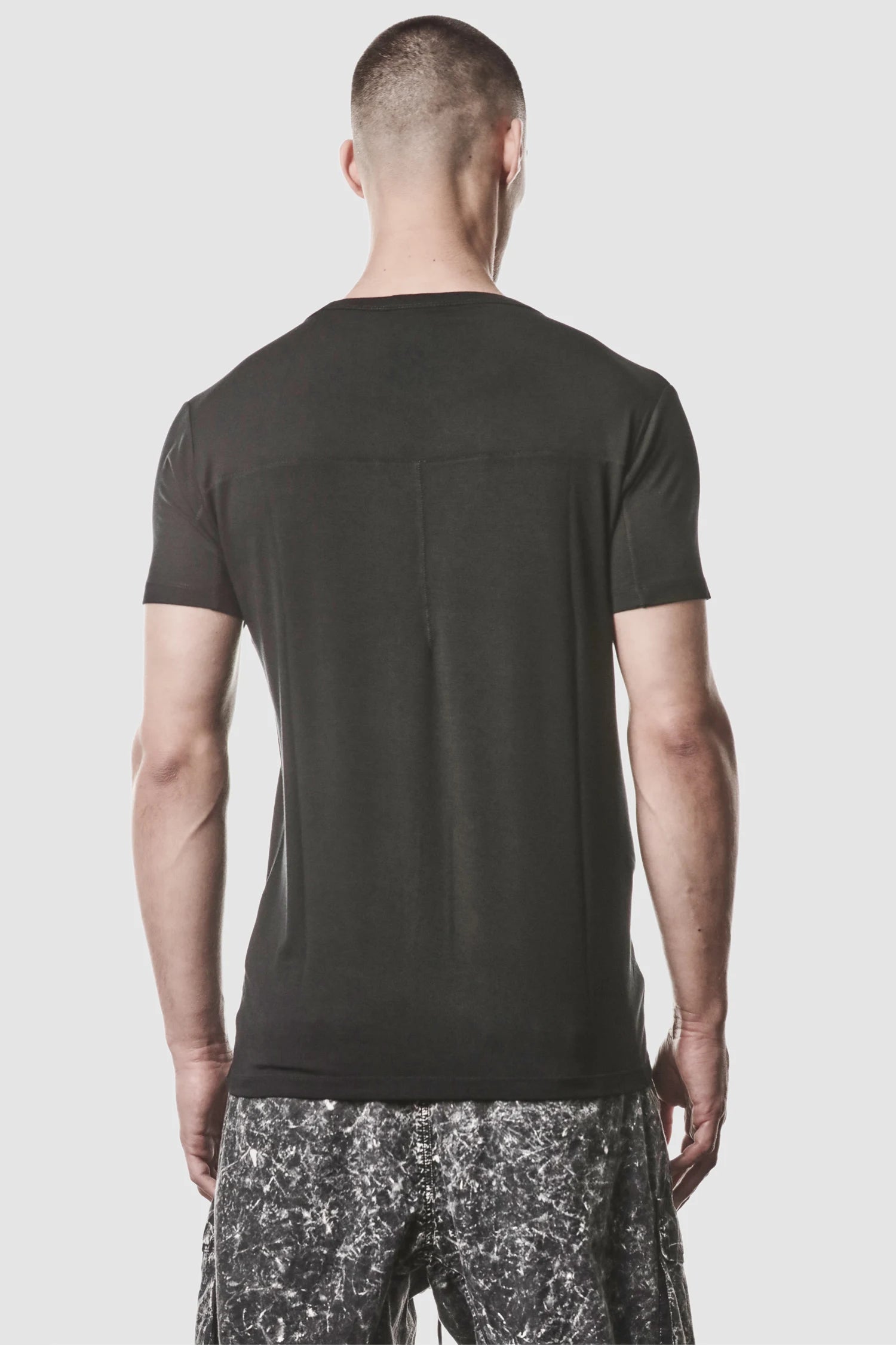 Thom Krom - model back view of men’s Black Modal Blend Jersey T-Shirt