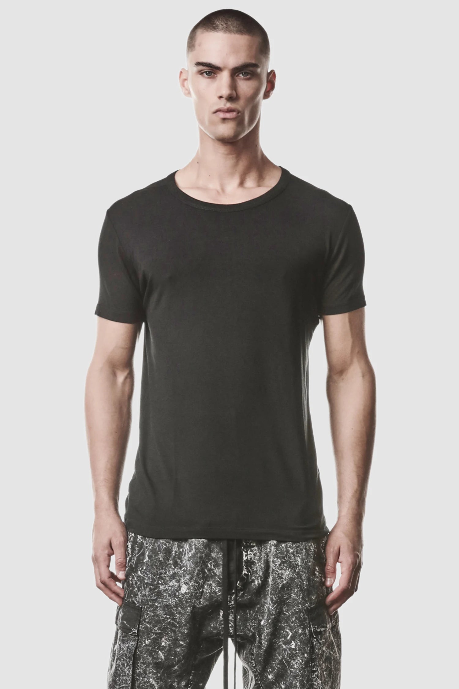Thom Krom - model front view of men’s Black Modal Blend Jersey T-Shirt