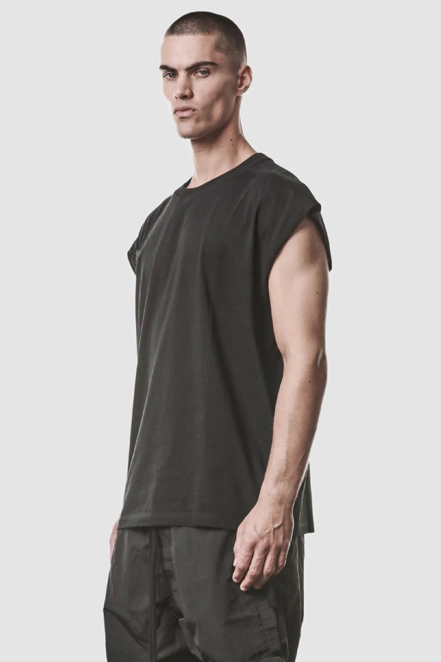 Thom Krom - model front side view of men’s Black Cotton Jersey Oversize Tank Top