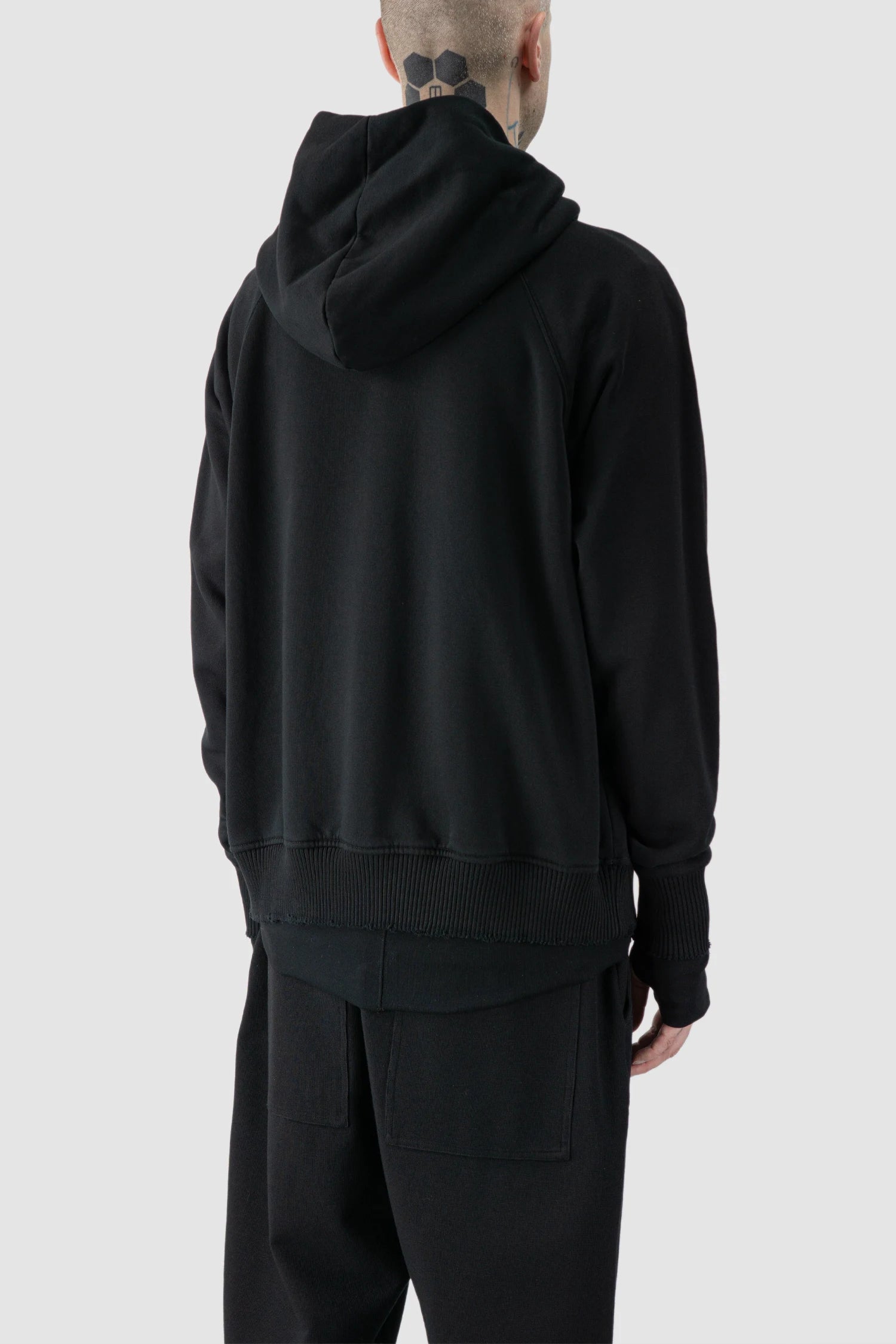 Thom Krom - model back side view of black Raglan Sleeve Cotton Hoodie with Destroyed Details - M-S-187