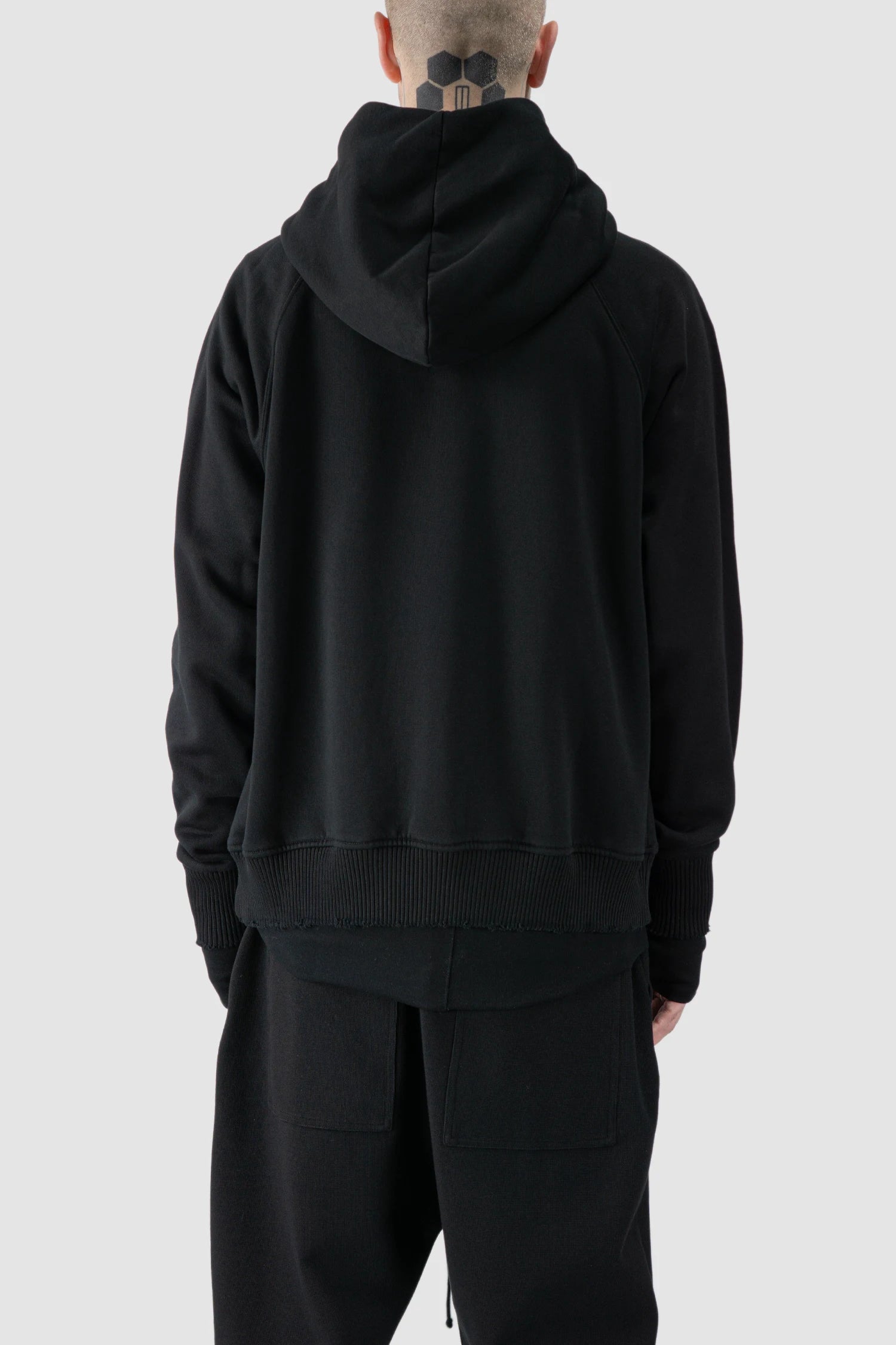 Thom Krom - model back view of black Raglan Sleeve Cotton Hoodie with Destroyed Details - M-S-187