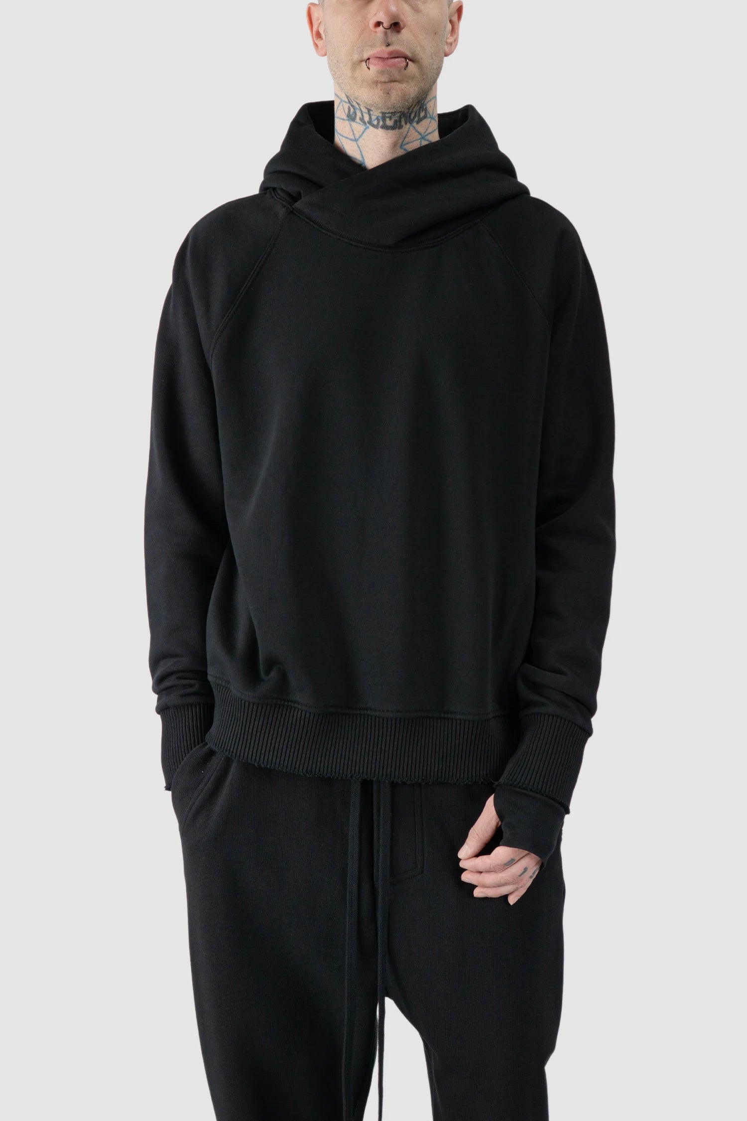 Thom Krom - model front relaxed view of black Raglan Sleeve Cotton Hoodie with Destroyed Details - M-S-187