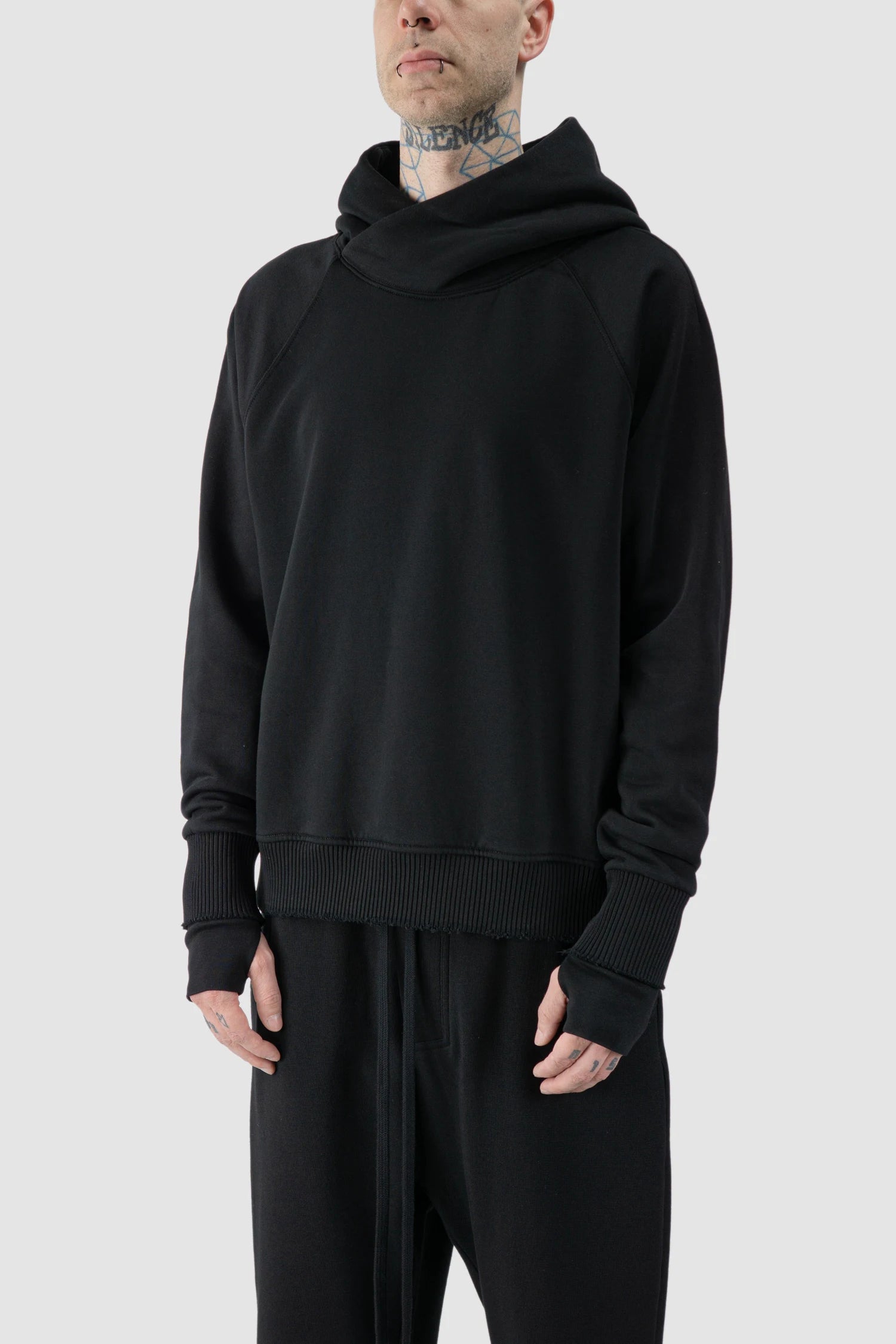 Thom Krom - model front side view of black Raglan Sleeve Cotton Hoodie with Destroyed Details - M-S-187