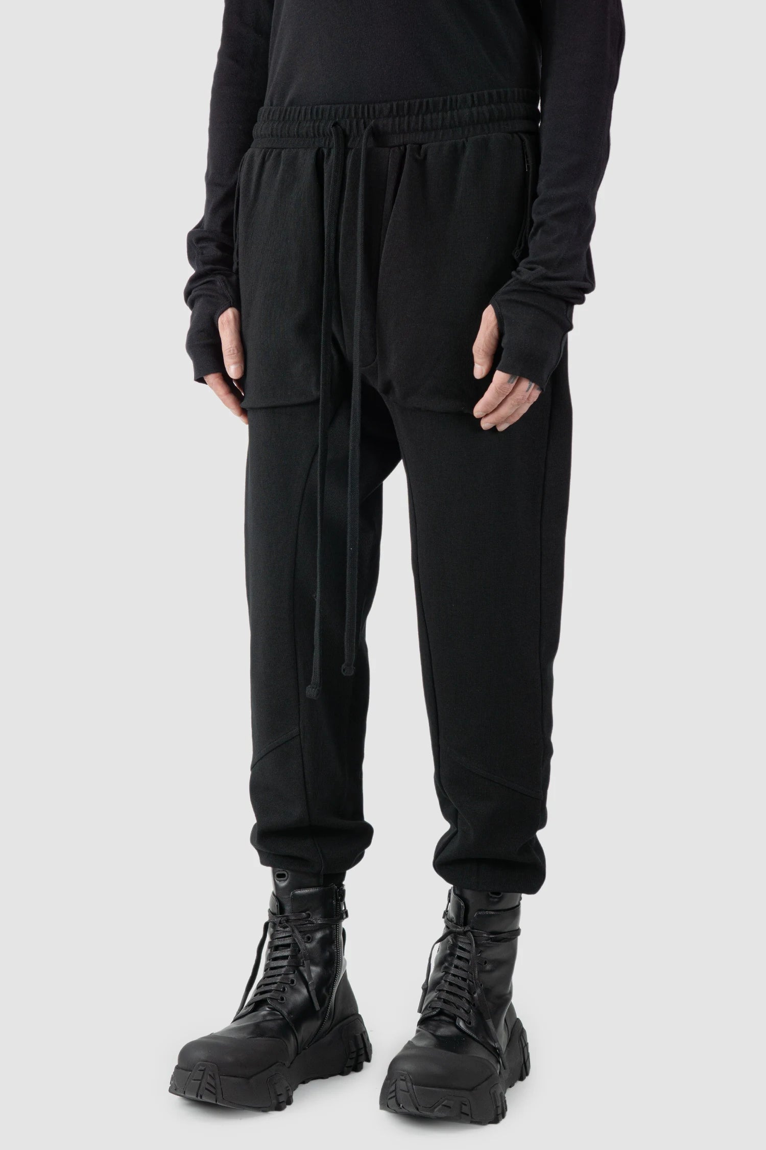 Thom Krom - model front side view of black Relaxed Fit Cotton Cargo Trousers with Zip Pockets - M-ST-509