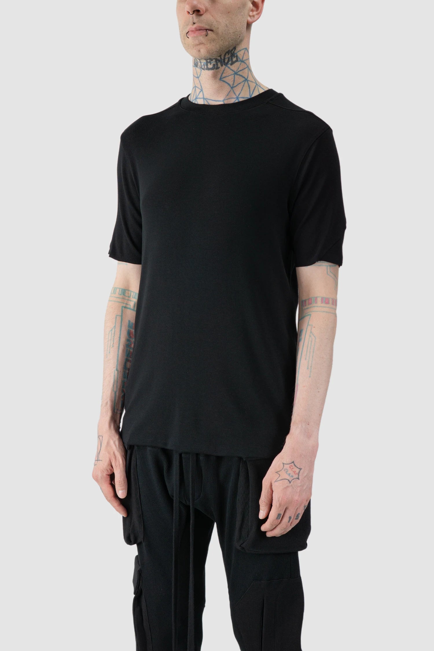 Thom Krom - model front side view of black Slim Fit Raw Edge Viscose T-Shirt - M-TS-890