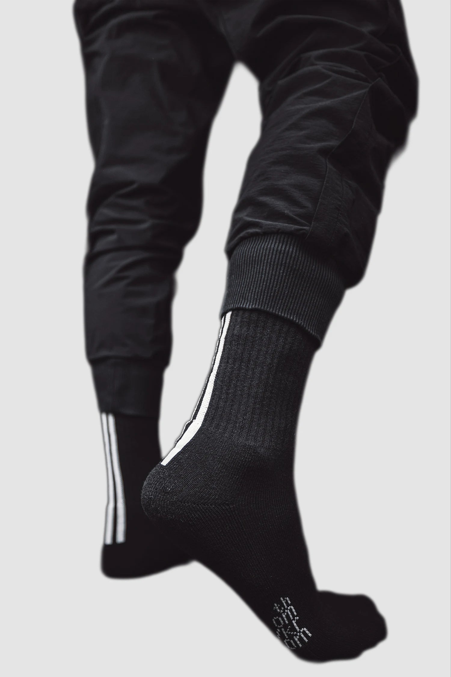 Thom Krom - back view of men's black Contrast Stripe Organic Cotton Socks - SOCK-10