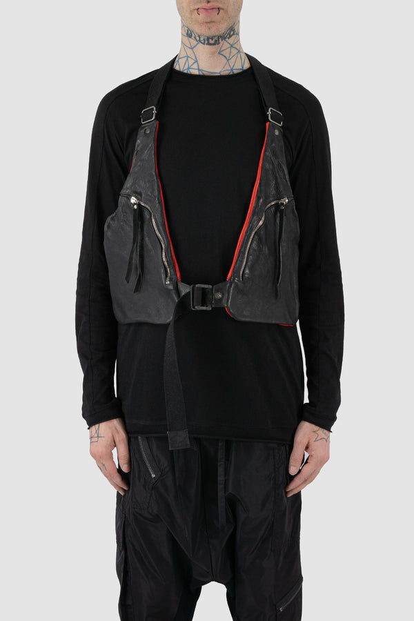 0.Hide - front view of vegetable tanned black and red horsehide leather cargo vest.