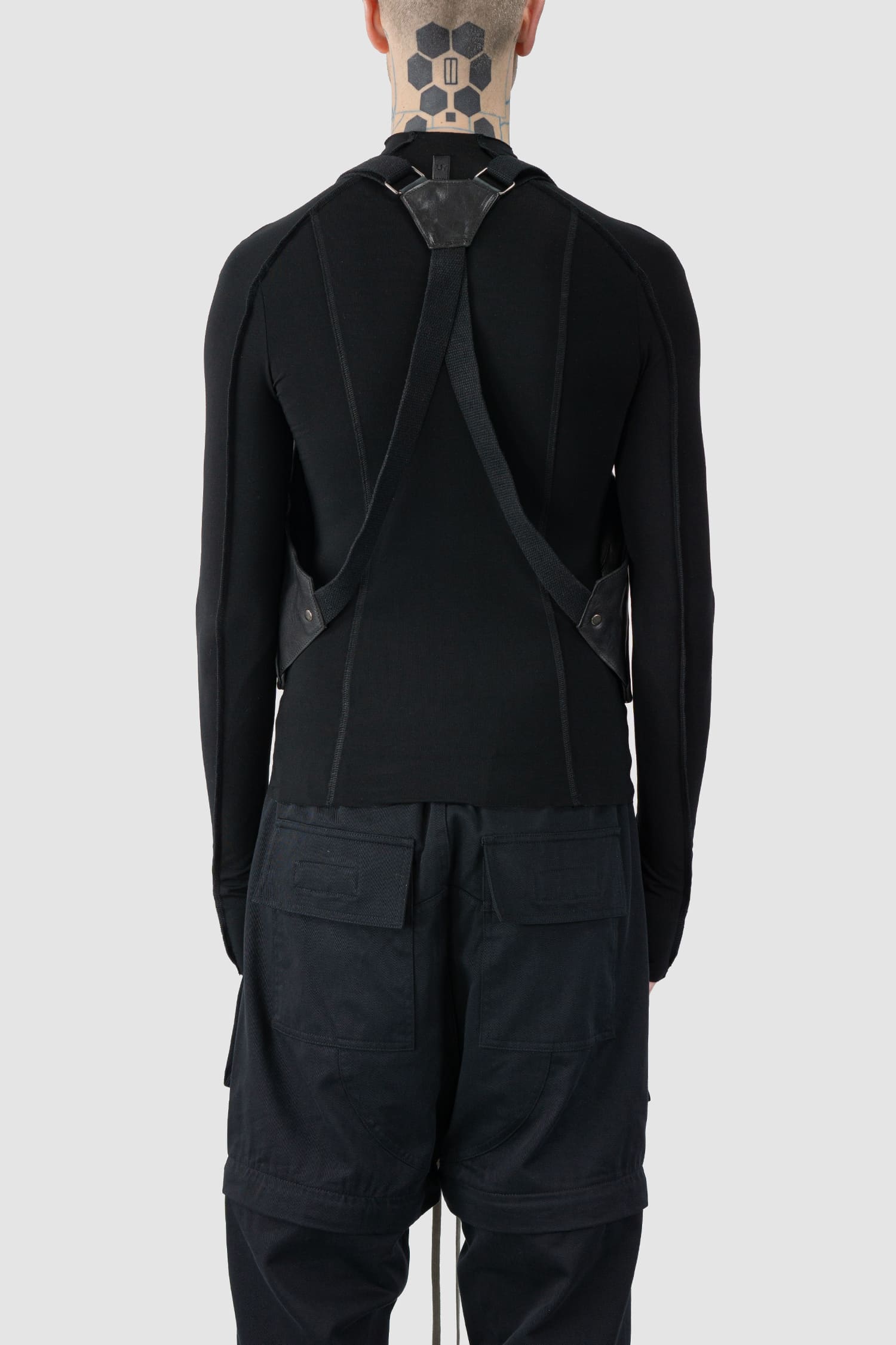 0.Hide - back person view of the black Horse Leather Cargo Vest Bag from the Permanent Collection.