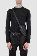 0.Hide - model front view of Vegetable Tanned Black Horse Leather Sling Bag.