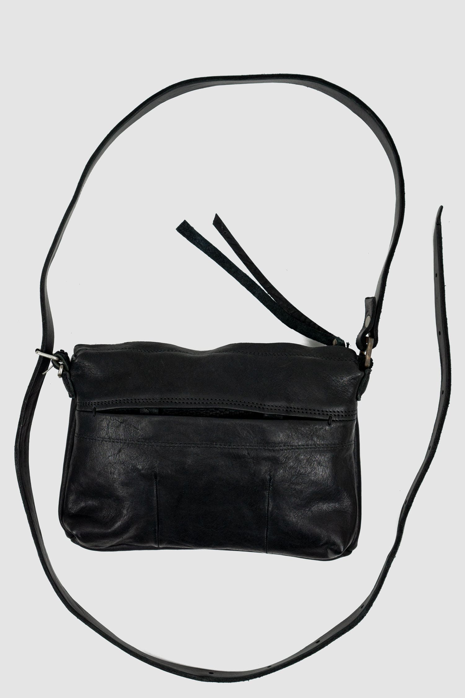 0.Hide - front view of black leather Essential Messenger Bag.
