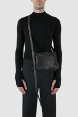 0.Hide - model front view of Tanned Black Leather Essential Bag.