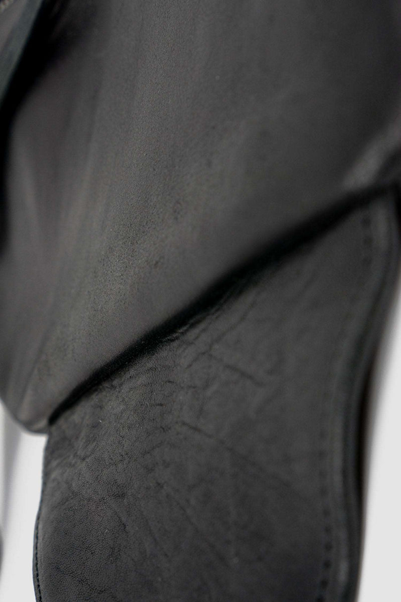 Detail view of Black Leather Vest Bag with zip pockets and adjustable straps, _0.HIDE
