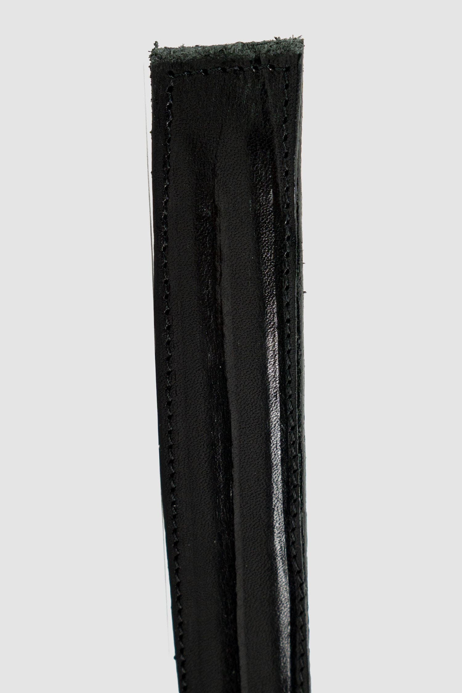 0.Hide - leather detail view of Vegetable Tanned Black Italien Bull Leather Metal Wire Belt. From the Permanent Collection with Steel Buckle detail.