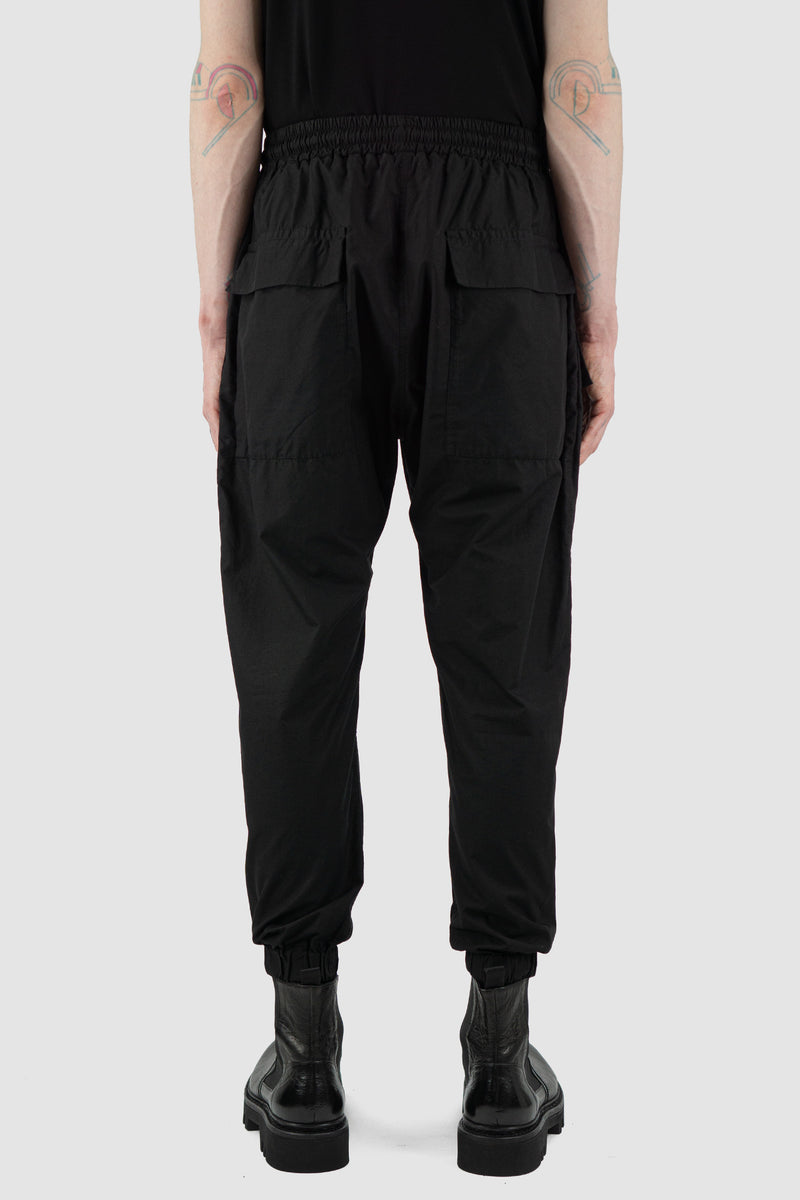 Back view of Black Light Pocket Pants for Men with elastic waistband, SS24, NOMEN NESCIO