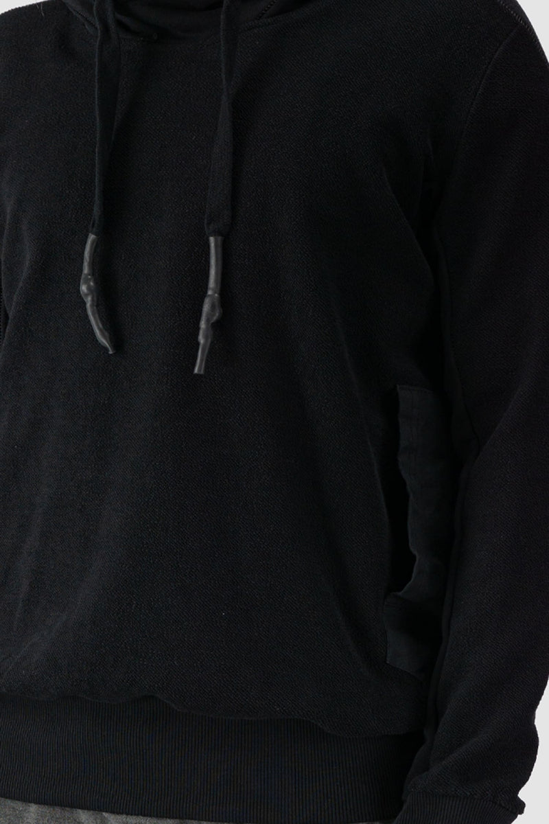 69 by Isaac Sellam - front detail view of Black Reverse Textured Cotton Hoodie