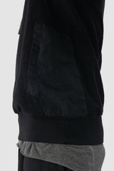 69 by Isaac Sellam - pocket detail view of Black Reverse Textured Cotton Hoodie