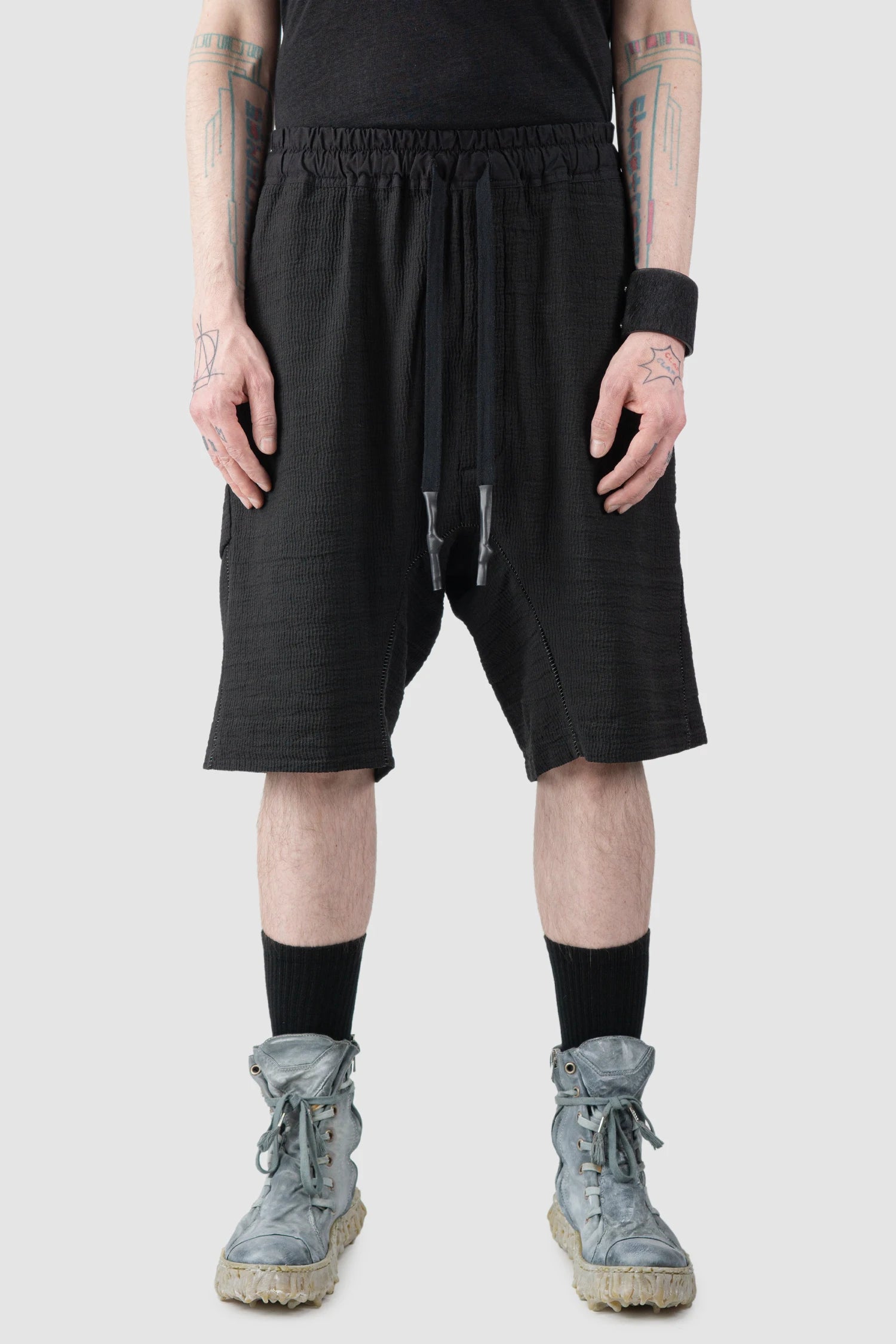 69 by Isaac Sellam - Men’s Black Drop Crotch Hidden Pocket Cotton Shorts model front view