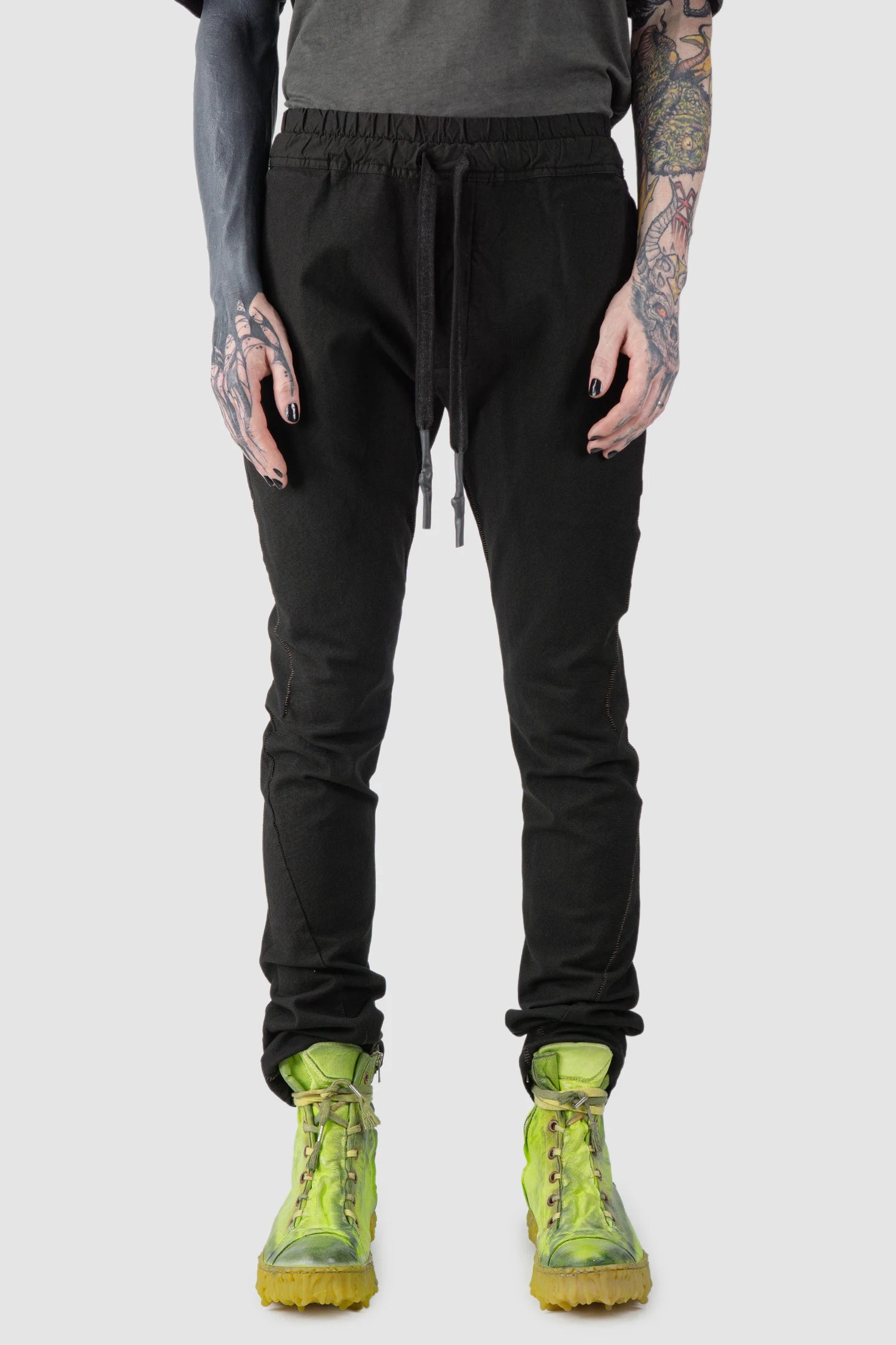 69 by Isaac Sellam - model front view of Black Fitted Cotton Cargo Trousers
