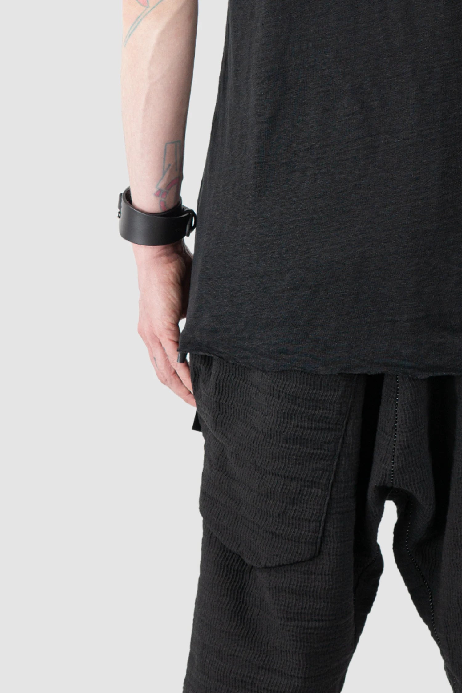 69 by Isaac Sellam - Men’s Black Linen T-Shirt with Horizontal Leather Detail hem close up view