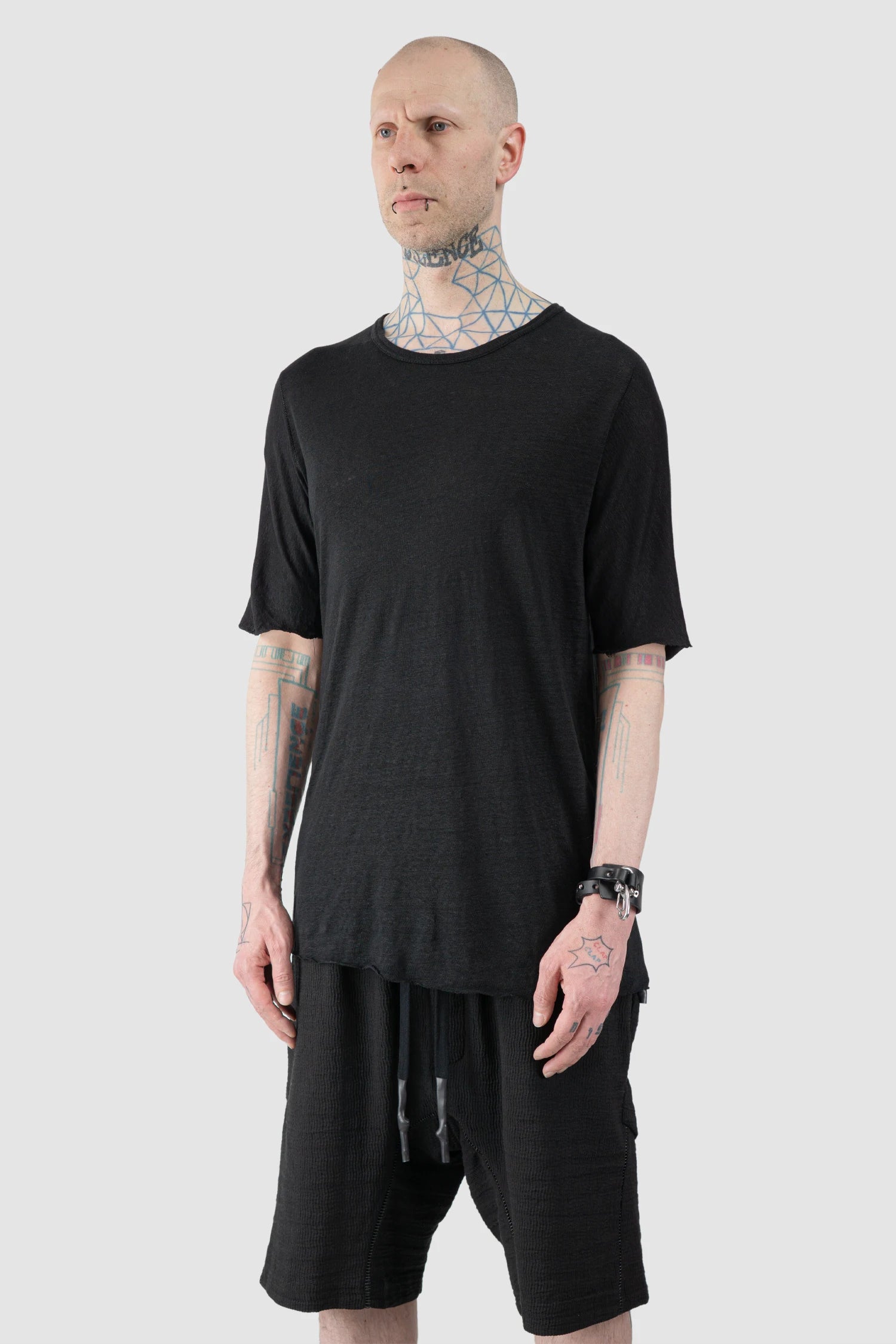 69 by Isaac Sellam - Men’s Black Linen T-Shirt with Horizontal Leather Detail model side view