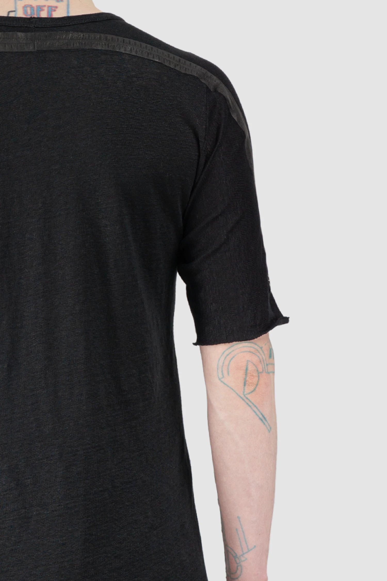69 by Isaac Sellam - Men’s Black Linen T-Shirt with Horizontal Leather Detail shoulder close up view