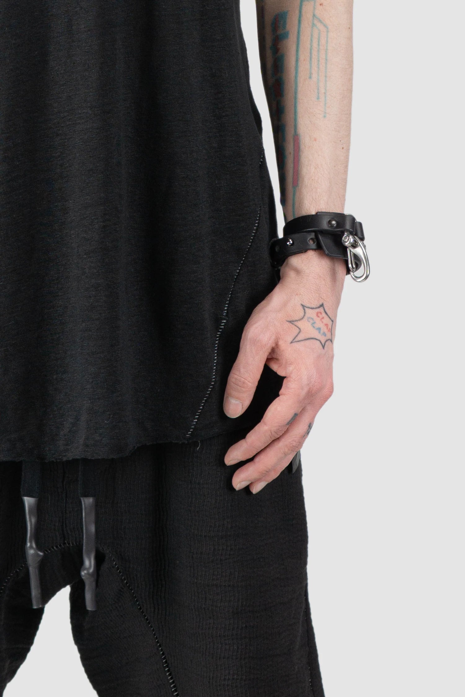 69 by Isaac Sellam - Men’s Black Linen Tank Top with Leather Spine Detail front hem view