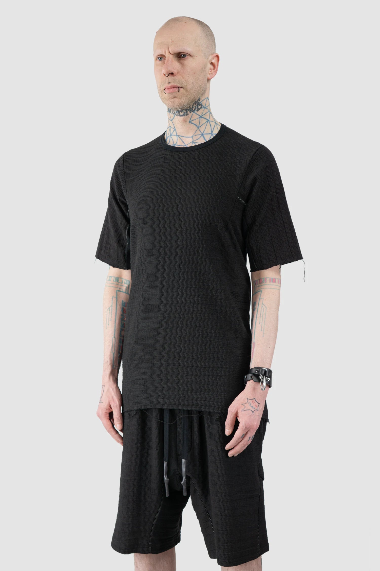 69 by Isaac Sellam - Men’s Black Mixed Structure Cotton T Shirt with Leather Spine model side view