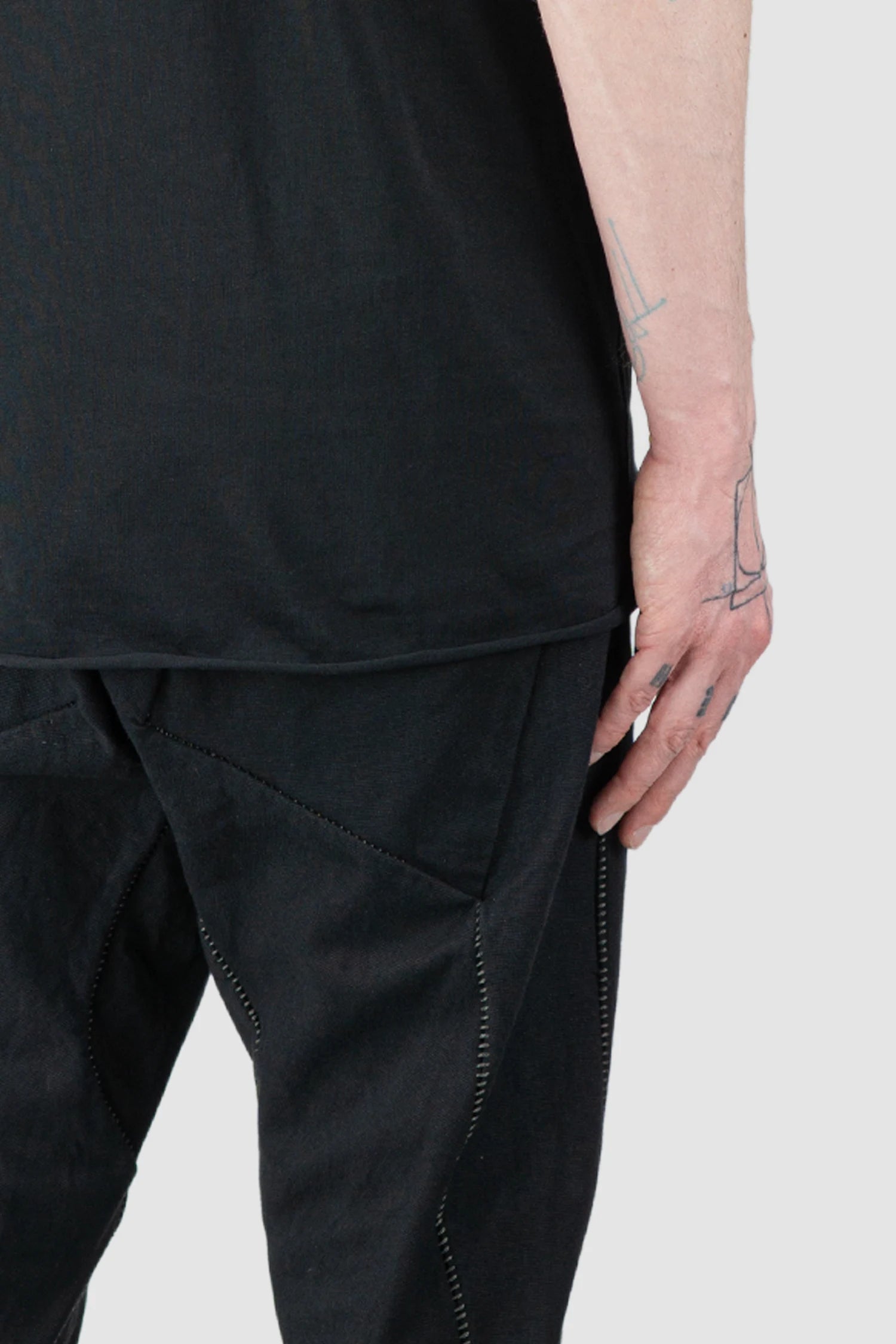 69 by Isaac Sellam - Men’s Black Organic Cotton T-Shirt with Leather Details hem detail view