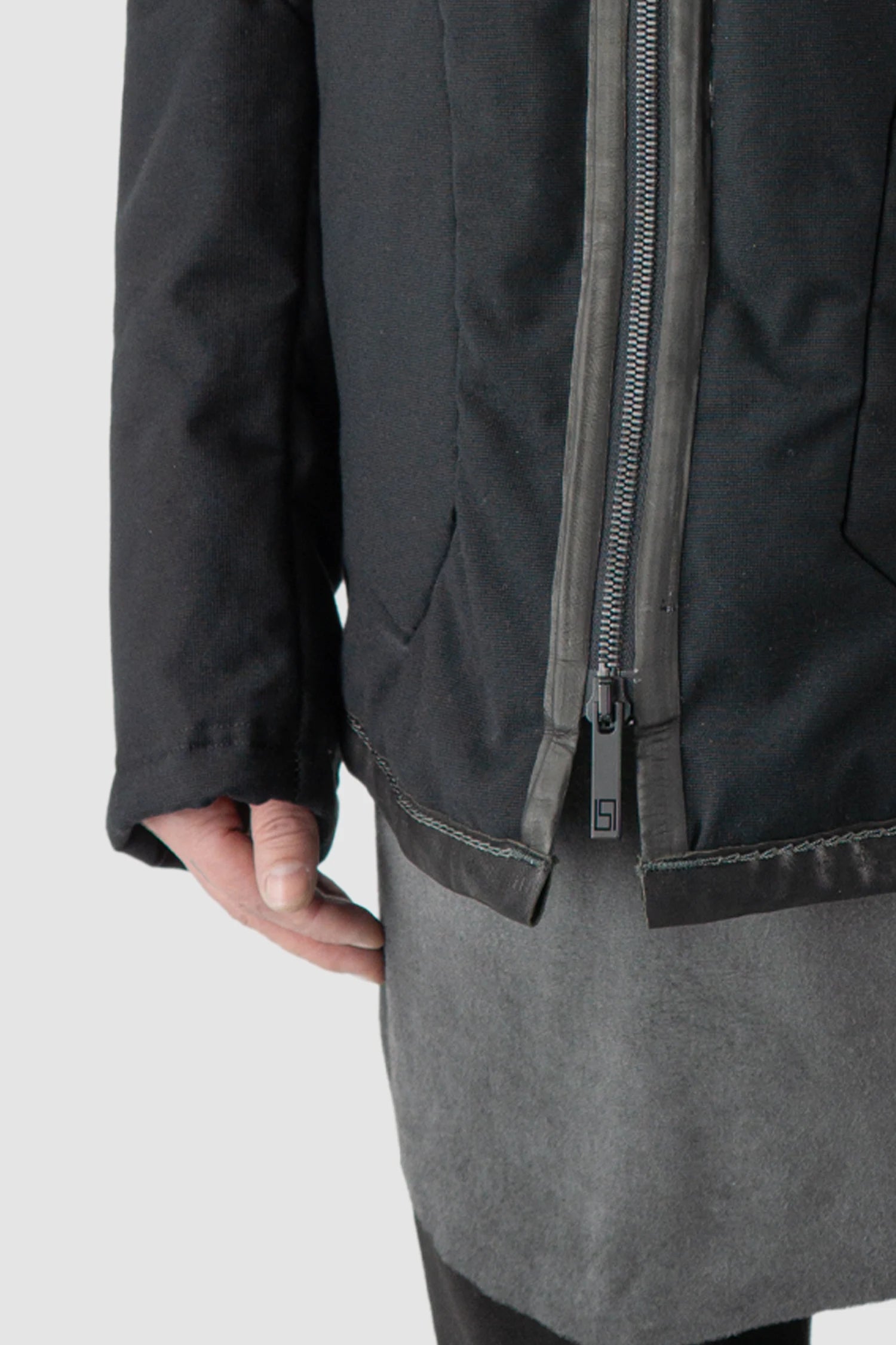 69 by Isaac Sellam - model front hem detail view of men’s Black Padded Cotton Jacket with Hood