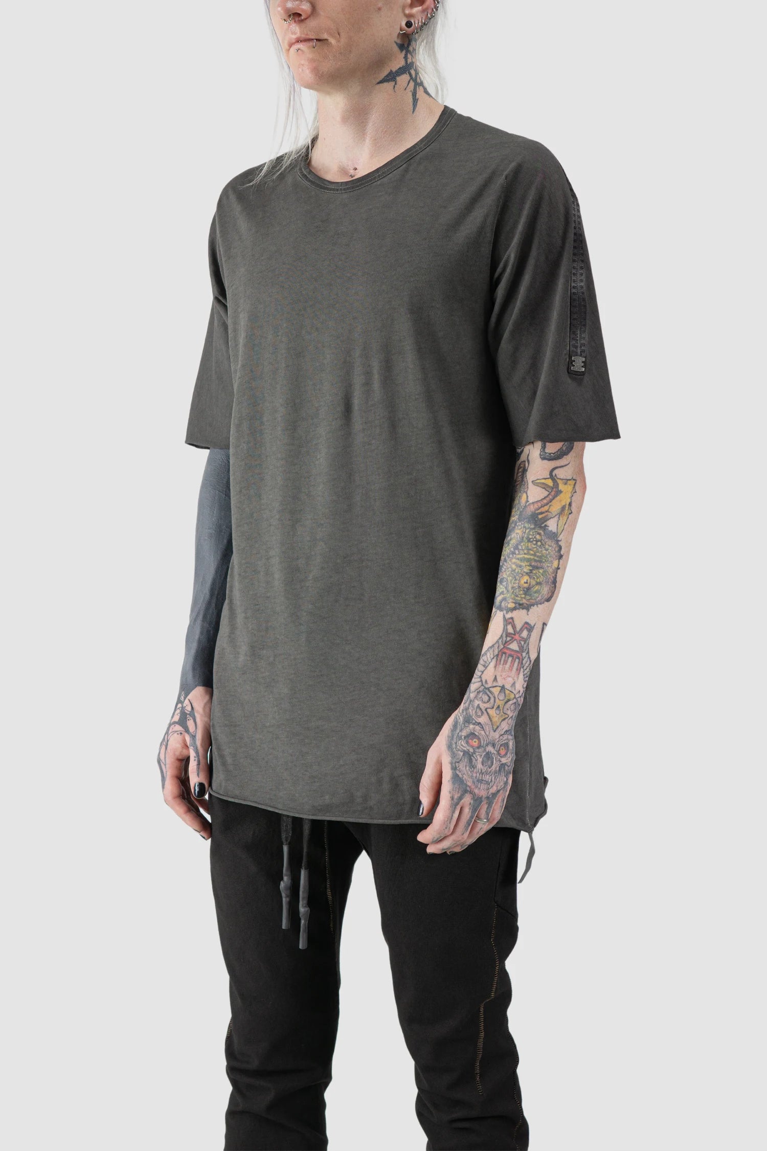 69 by Isaac Sellam - model front side view of Grey Object Dyed Leather Spine Short Sleeve Tee