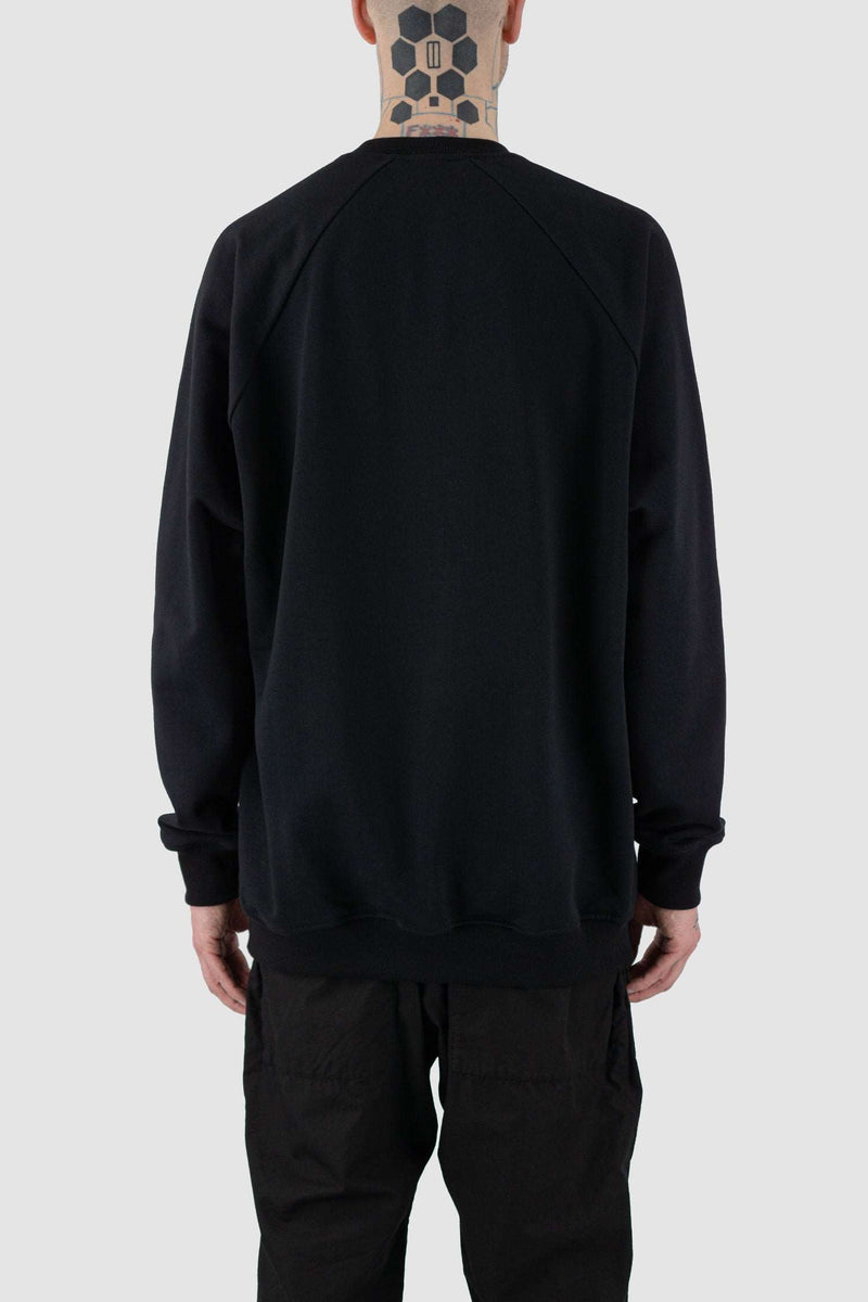 Back view of Black Raglan Sweatshirt for Men with relaxed fit and wool rib details, SS24, NOMEN NESCIO