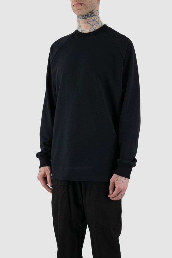 Side view of Black Raglan Sweatshirt for Men with relaxed fit and wool rib details, SS24, NOMEN NESCIO