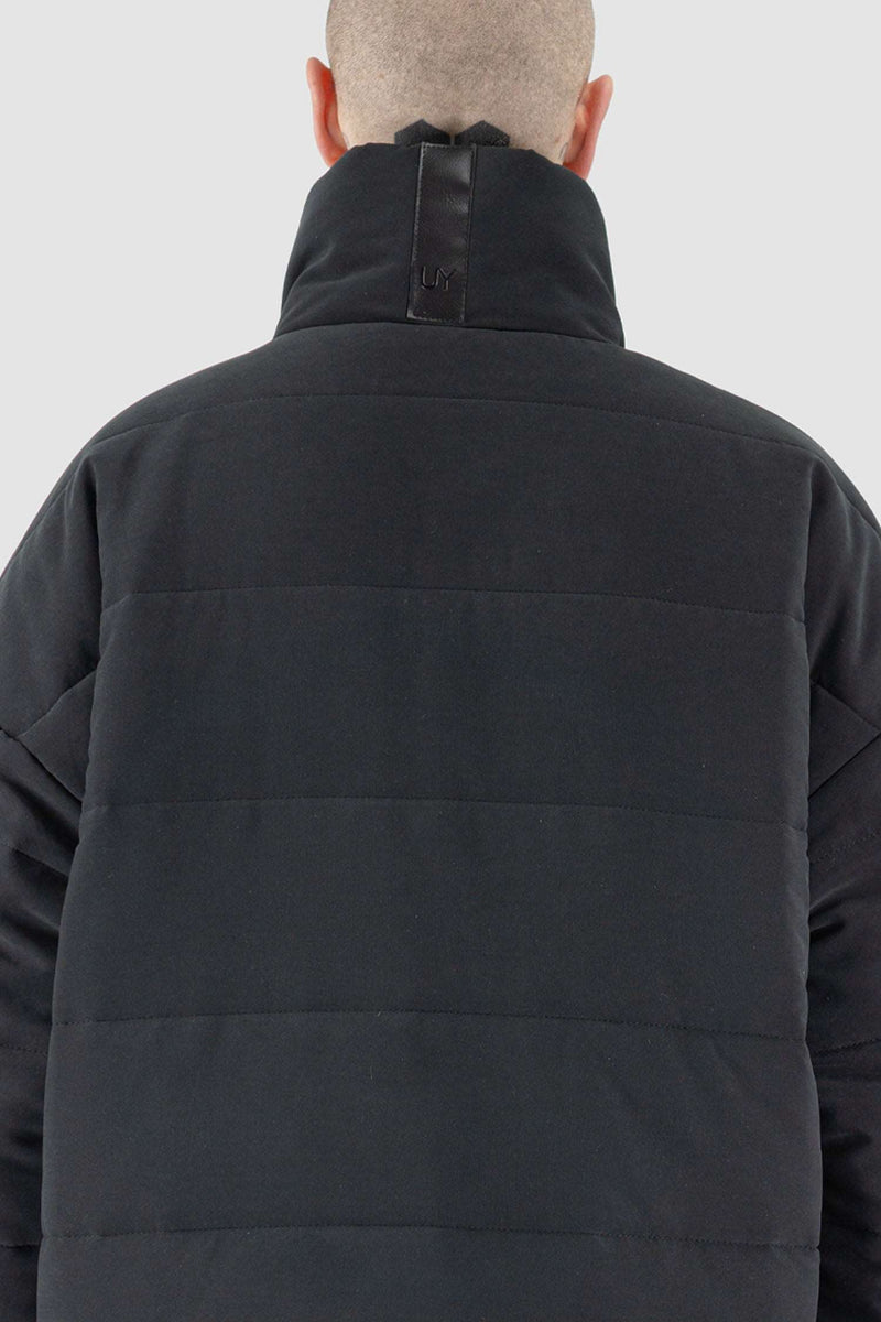 Back Close-Up of FW23 Black Puffer Coat - High Neck Collar and Ribbed Knit Cuffs by UY StudioUY STUDIO Black Big Puffer Coat - FW23 'BACK TO SCHOOL' Collection | Oversize Fit, Double Zip Closure, Ribbed Knit Cuffs | High Neck Collar, Vegan Leather Label | Made in Poland