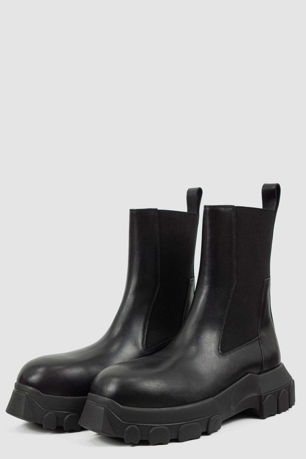 Rick Owens Black Bozo Tractor Boots for Men from the FW21 Collection with Elastic Rubber Band and pull tab Detail, front right.