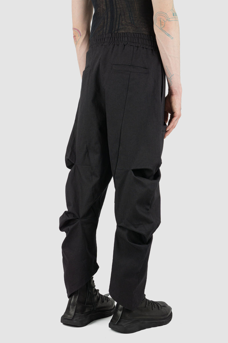 Back view of Black Bull Denim Pants for Men with elastic waistband and cargo side pockets, LA HAINE INSIDE US