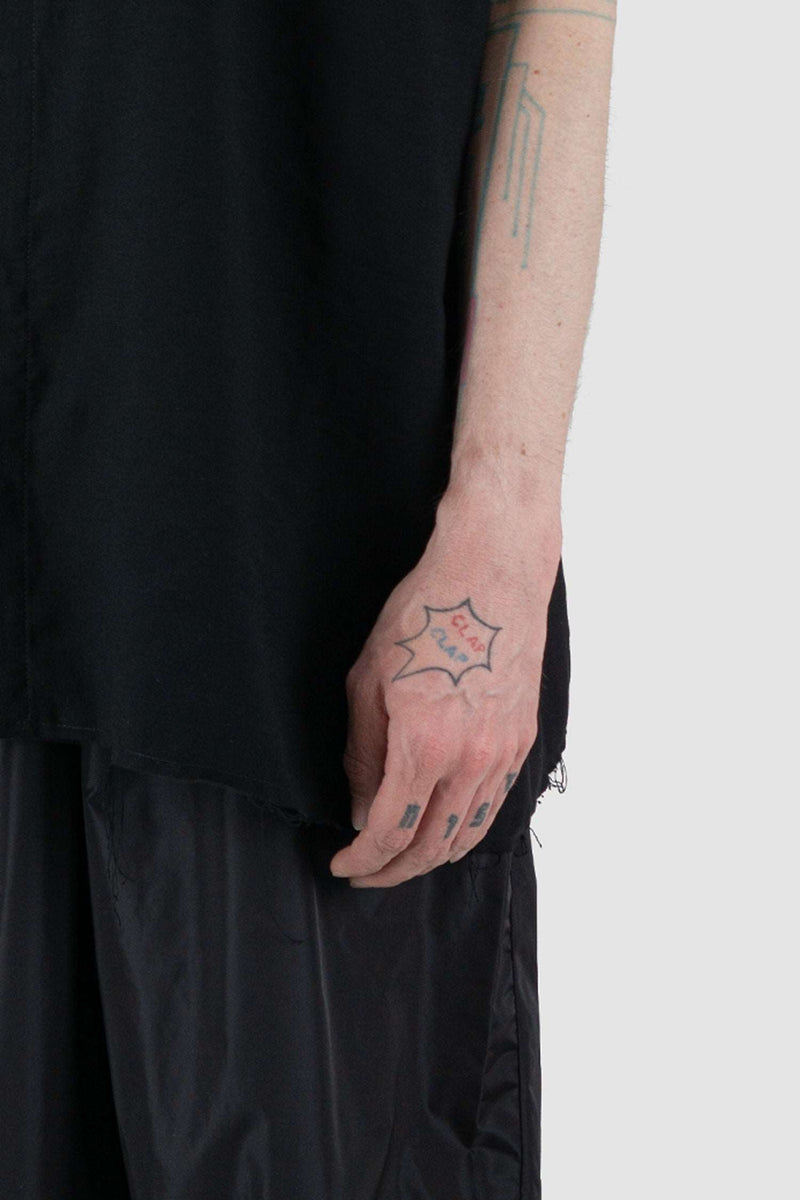 Close-Up of Black Sleeveless Oversize Shirt with Raw Edge Finishing by UY Studio