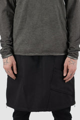 Culture of Brave - Front hem view of black object-dyed seamless organic cotton men's L/S T-shirt, Permanent Collection.